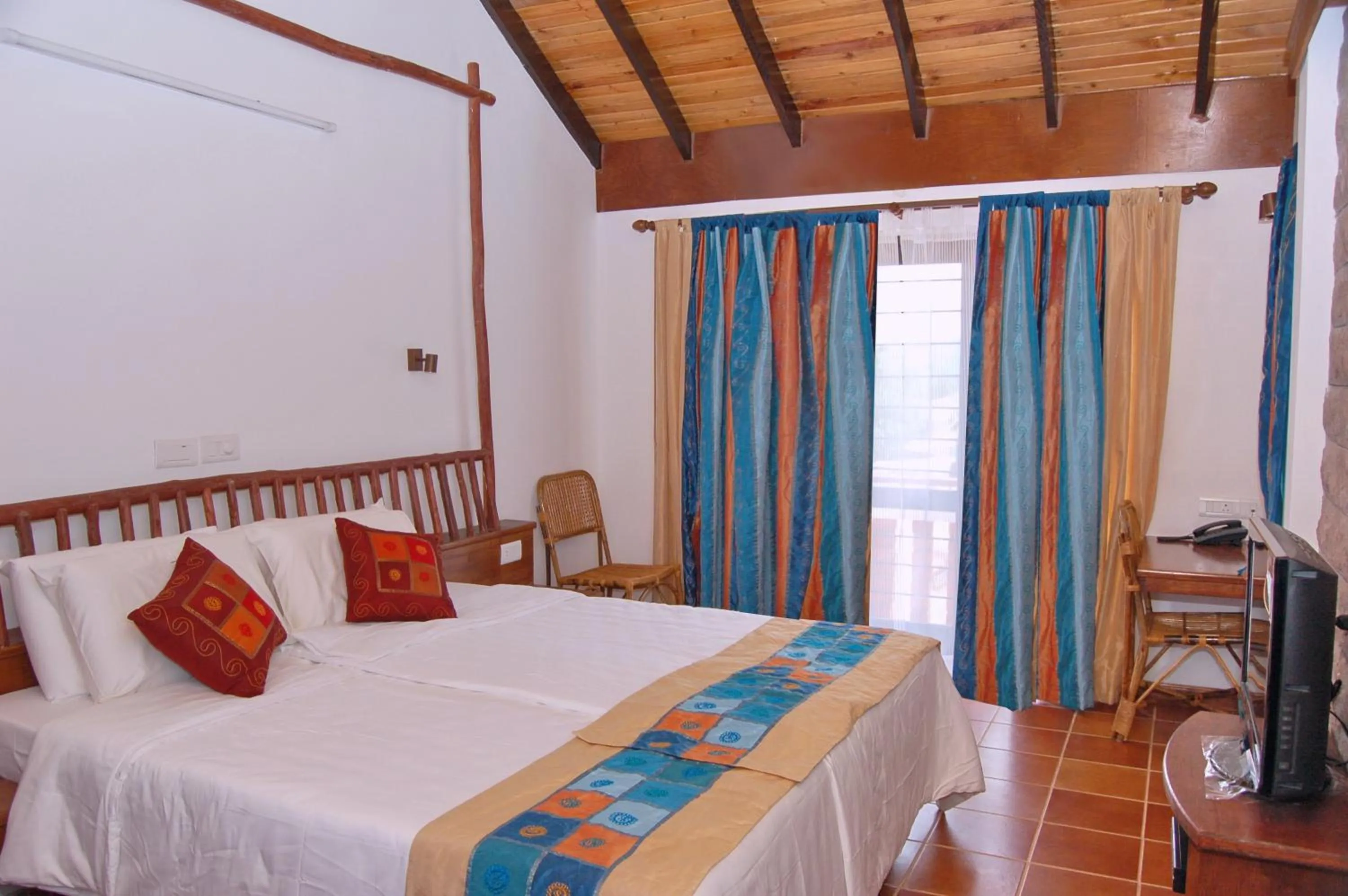 Bedroom, Bed in Kadambavanam Ethnic Village Resort