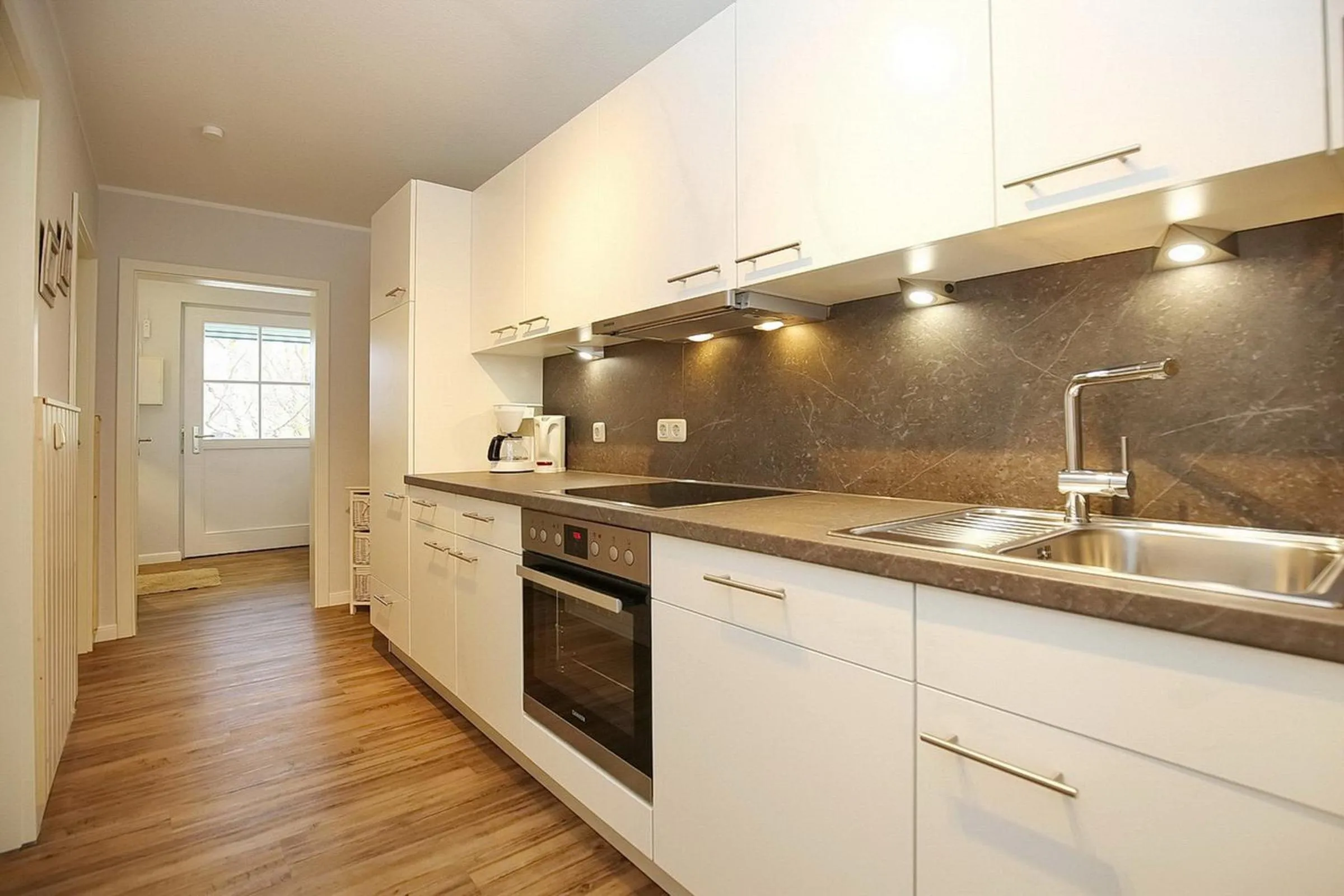 Kitchen or kitchenette in Papillon Wohnung 10-6