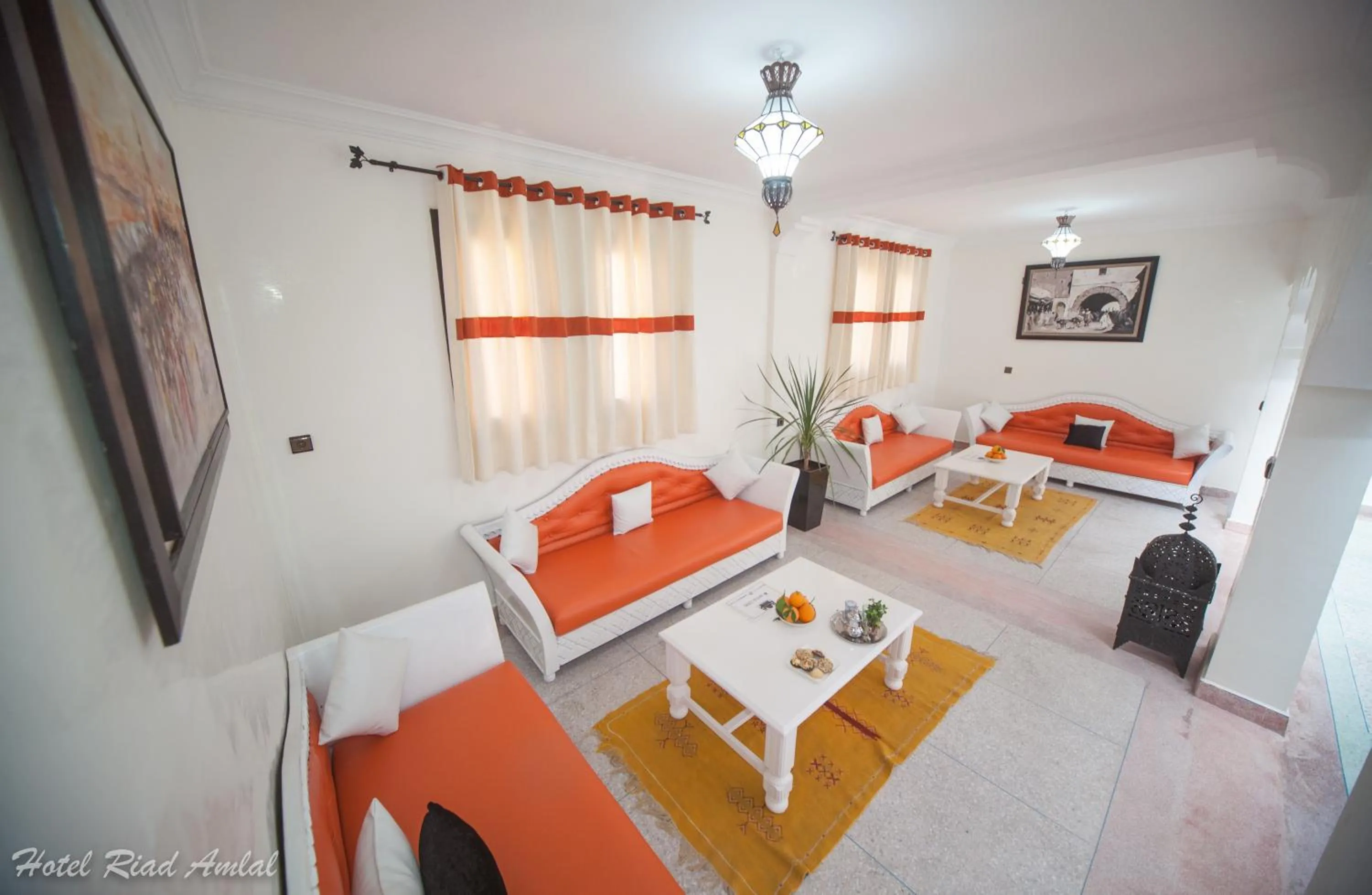 Living room, Bed in Hotel Riad Amlal