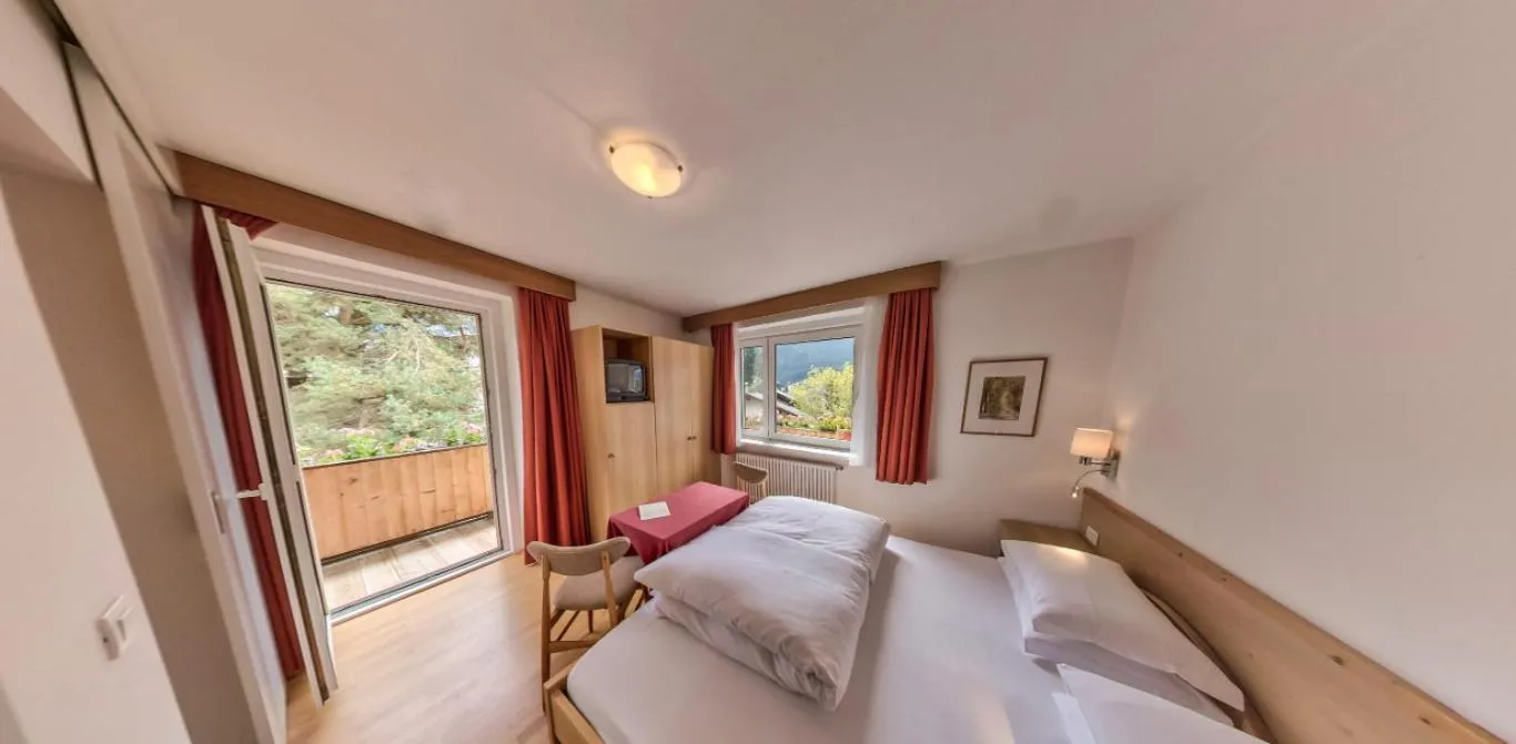 Bed in AppartChalet LA RONDULA - 100m from Seceda