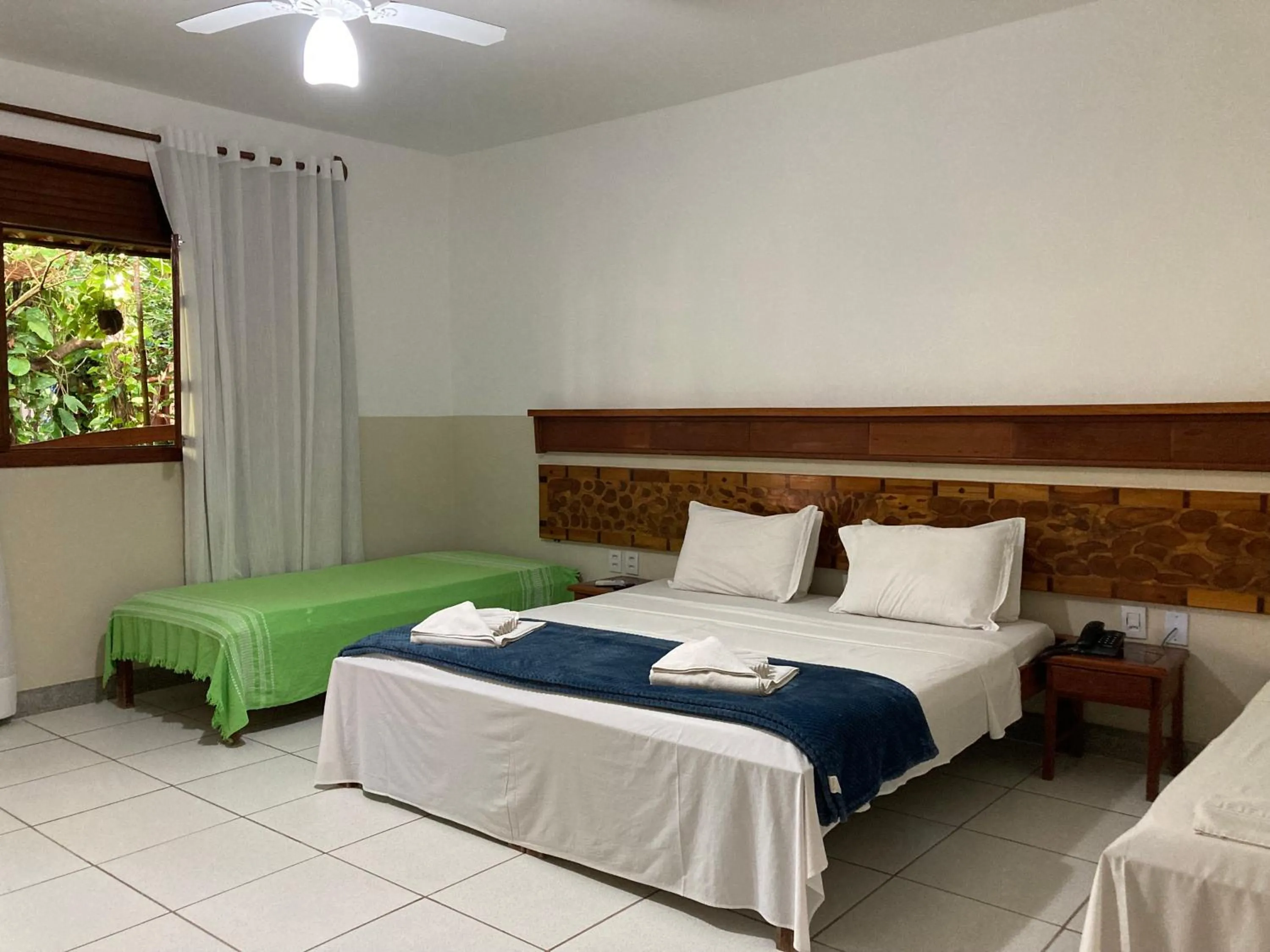 Bed in Pousada Pau Brasil Ubu