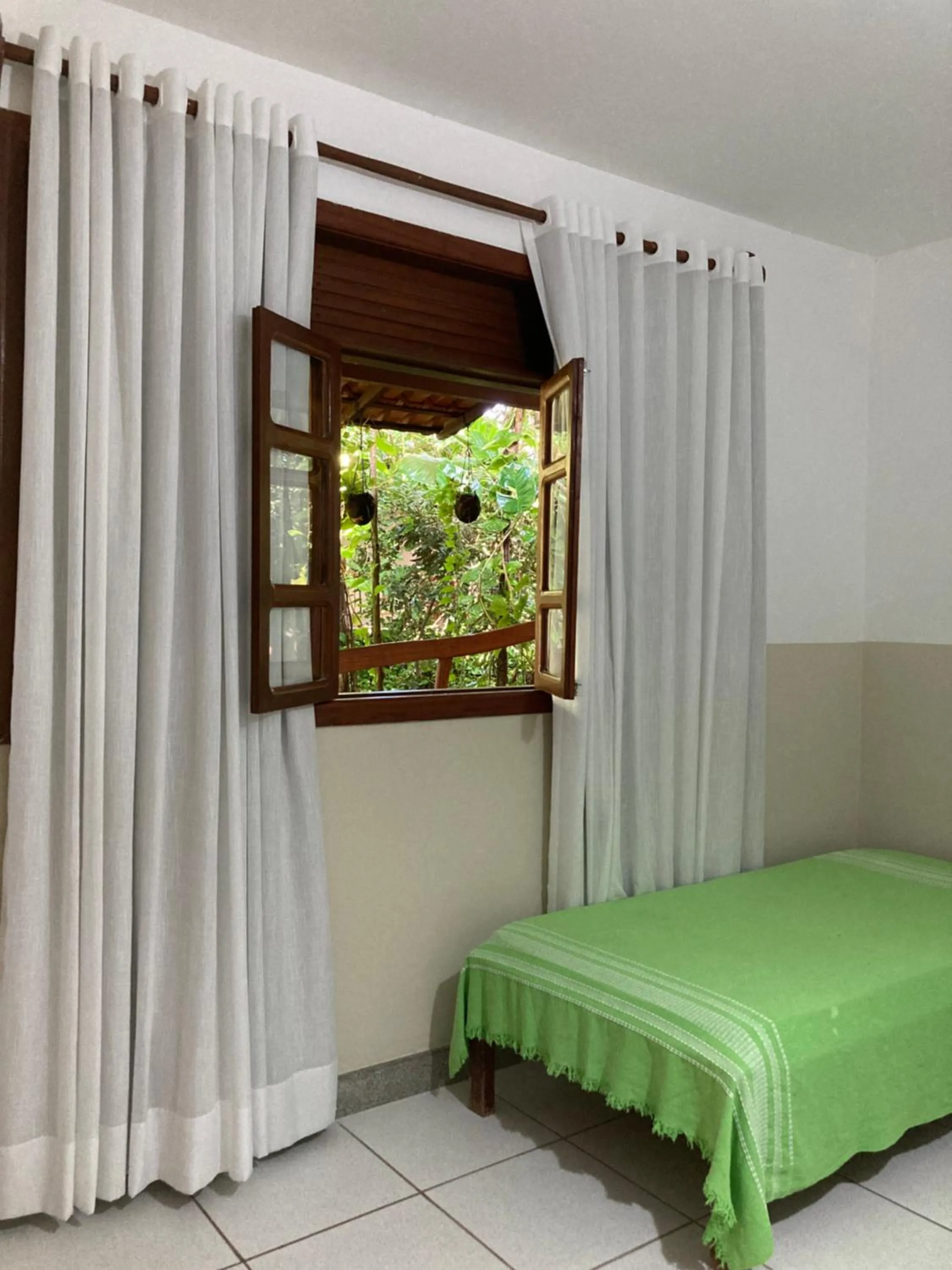 Bed in Pousada Pau Brasil Ubu