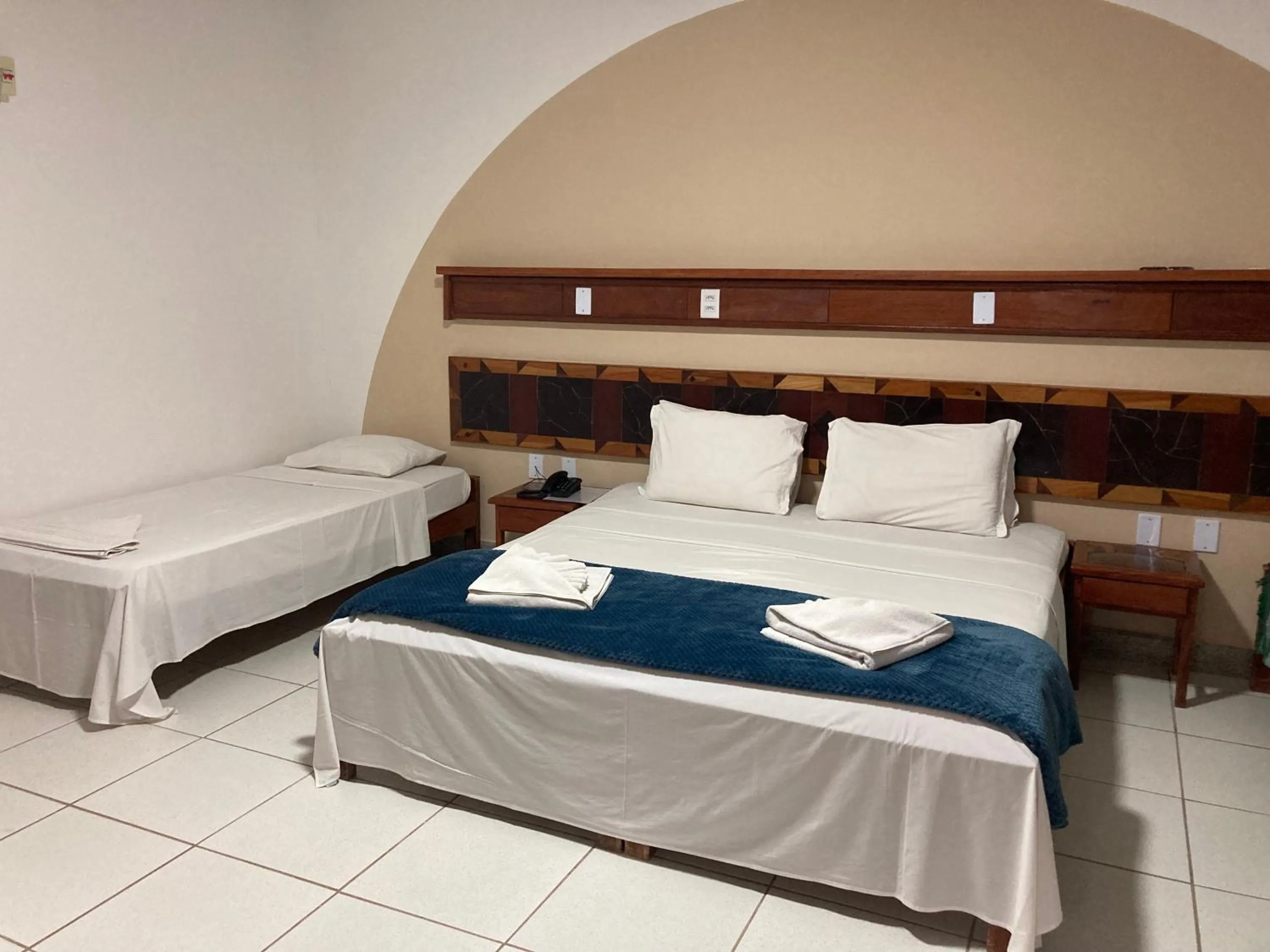 Bed in Pousada Pau Brasil Ubu