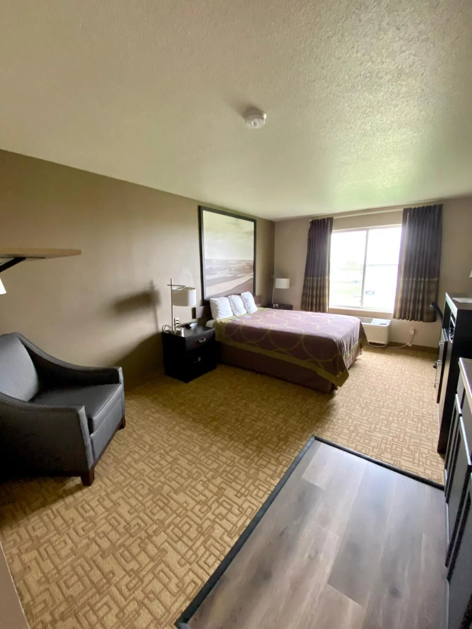 Bed in Super 8 by Wyndham Jackson MN