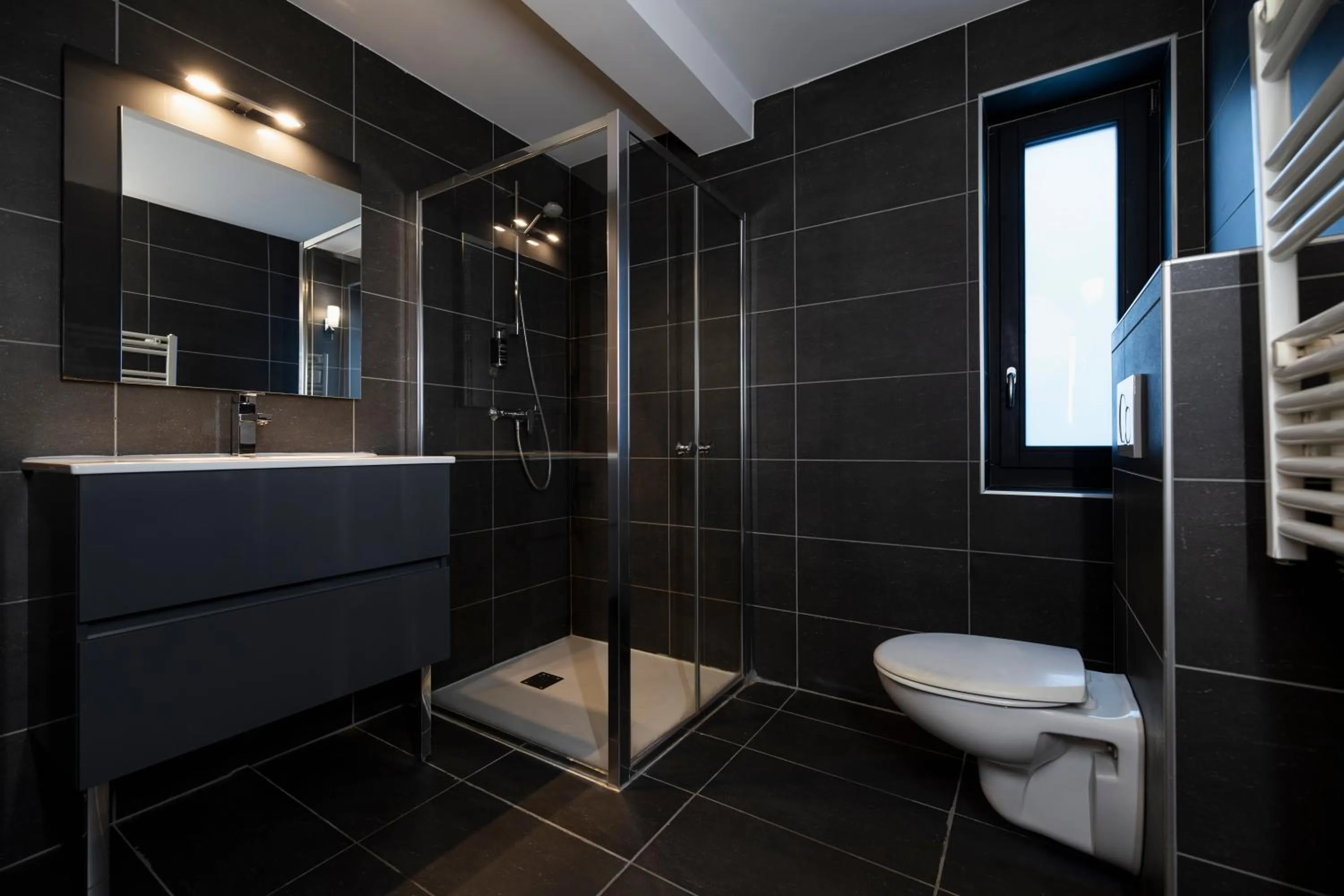 Shower in Hôtel de L'Arve by HappyCulture