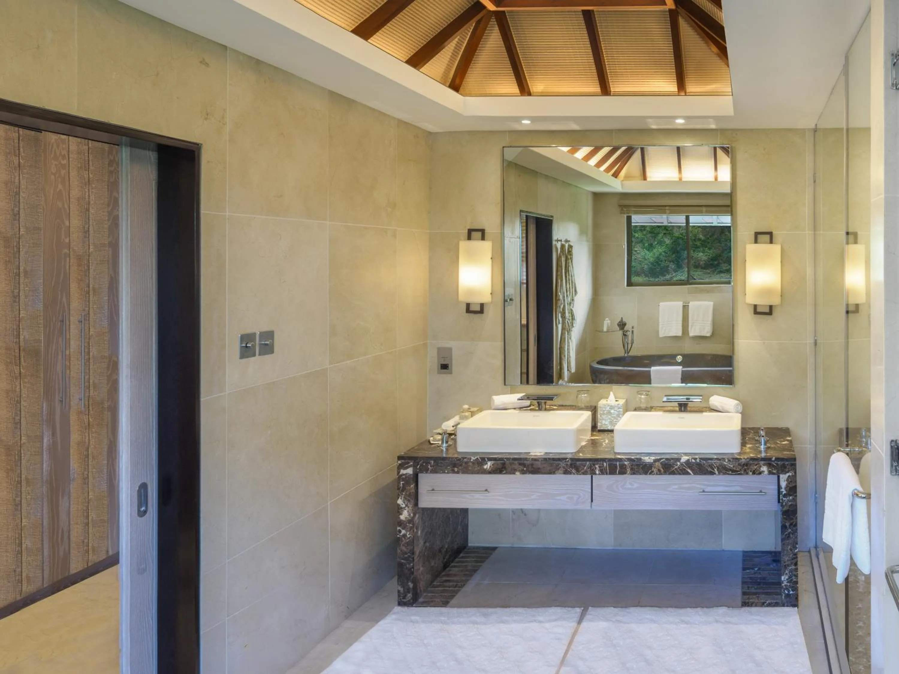 Bathroom, Bed in Four Seasons Resort Mauritius at Anahita