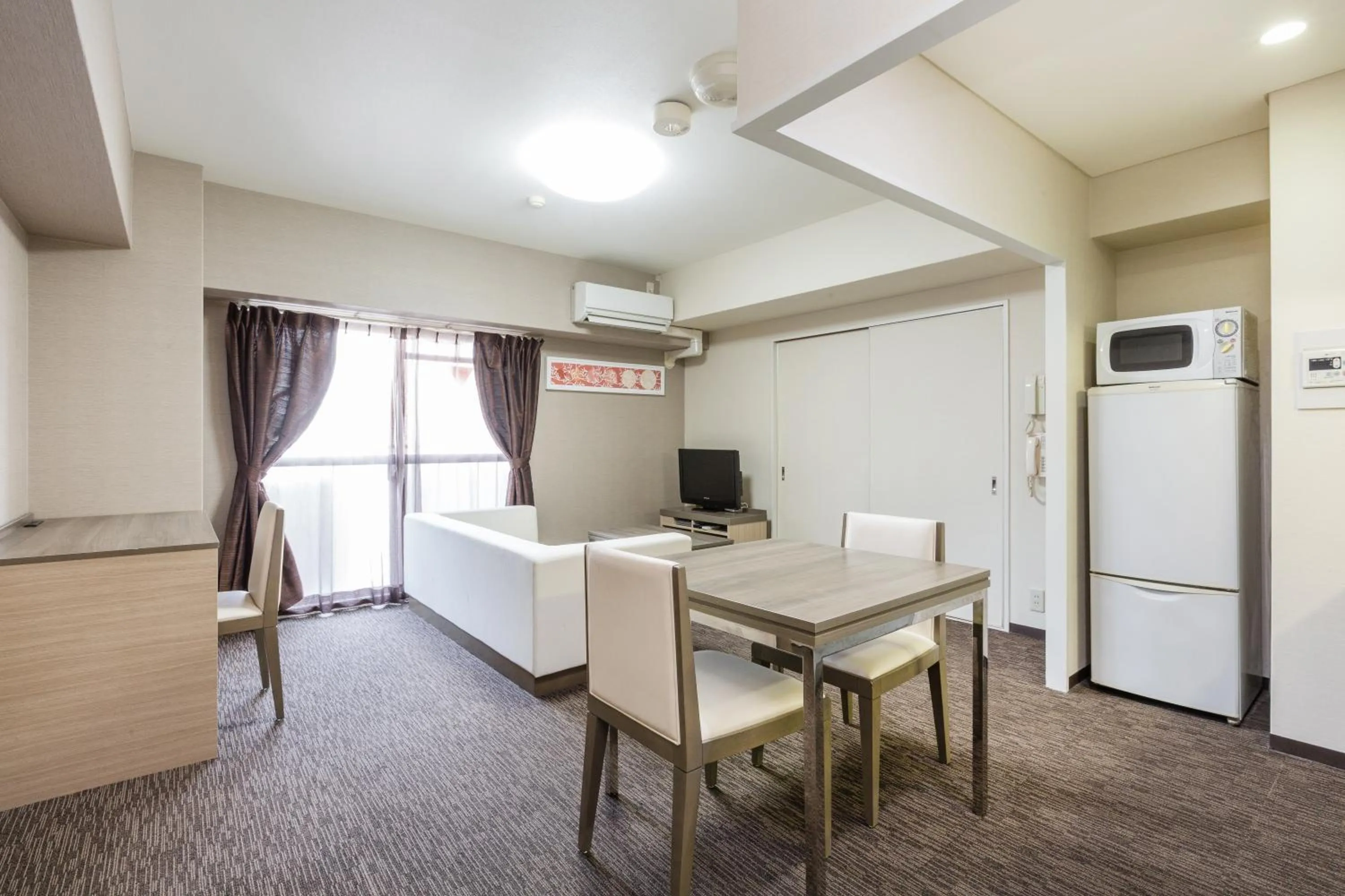 Living room, Bed in HOTEL MYSTAYS Otemae