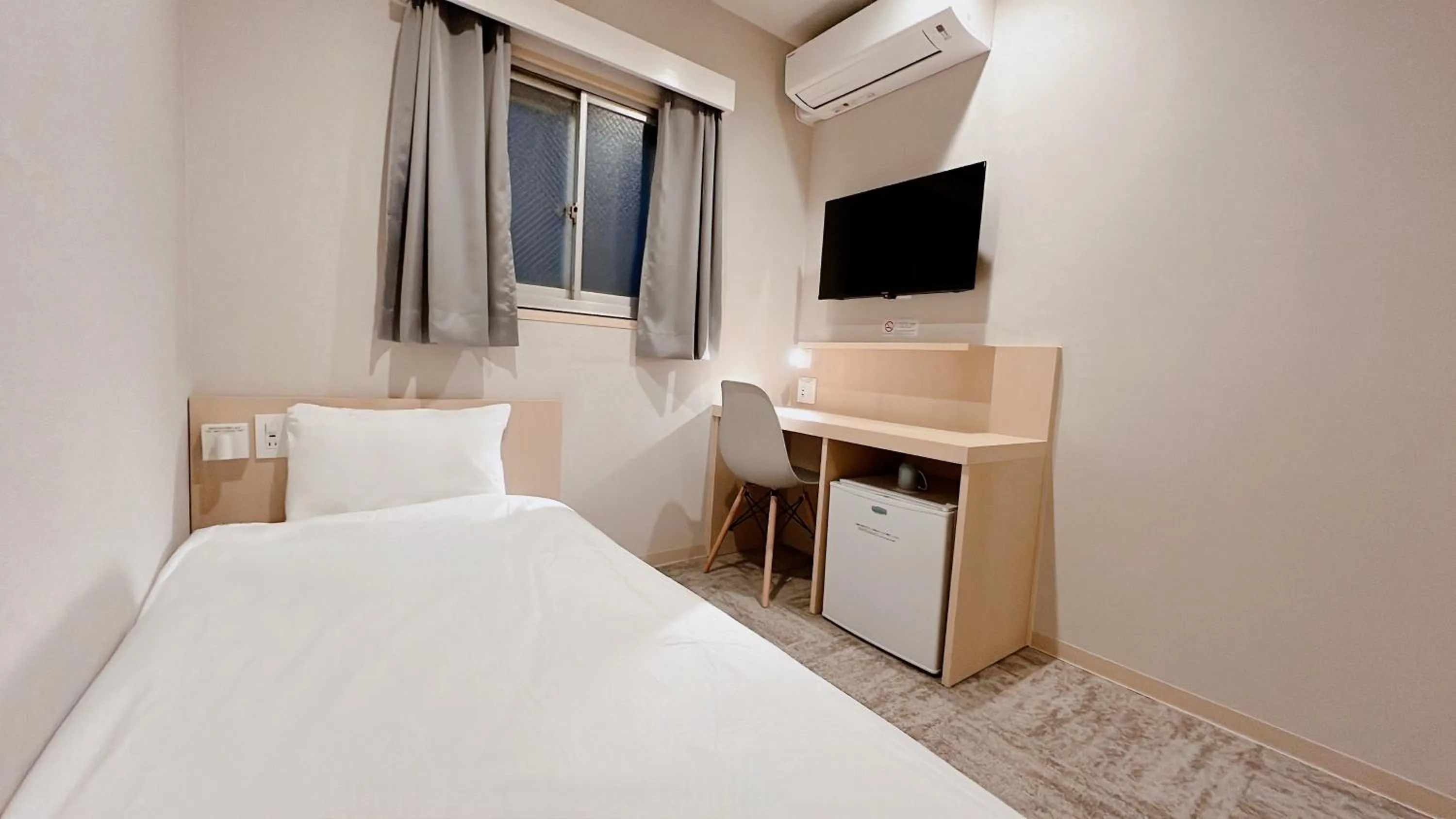 Bed in Hotel Kiyoshi Nagoya