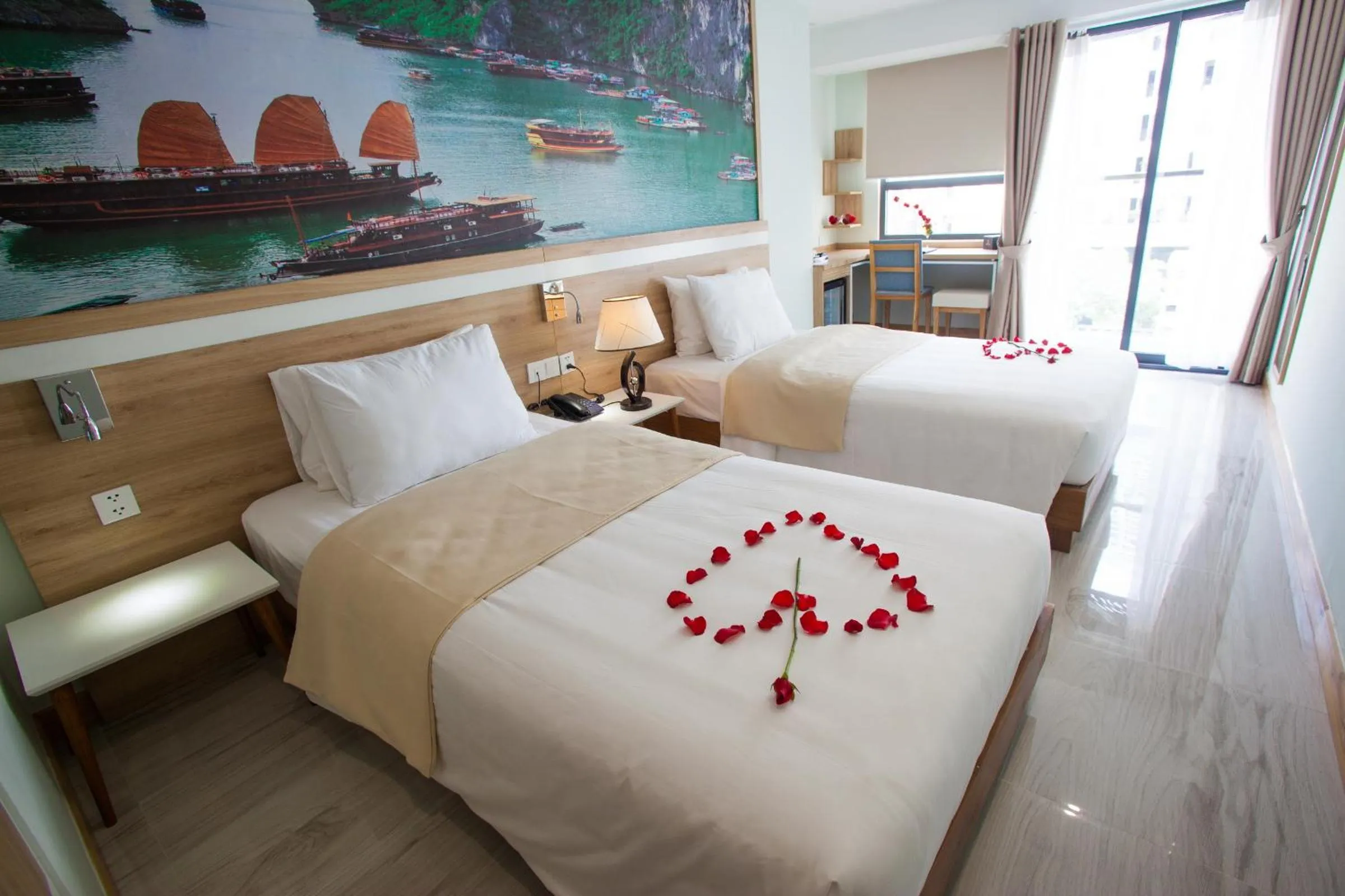 Bed in Royal HPM Hotel