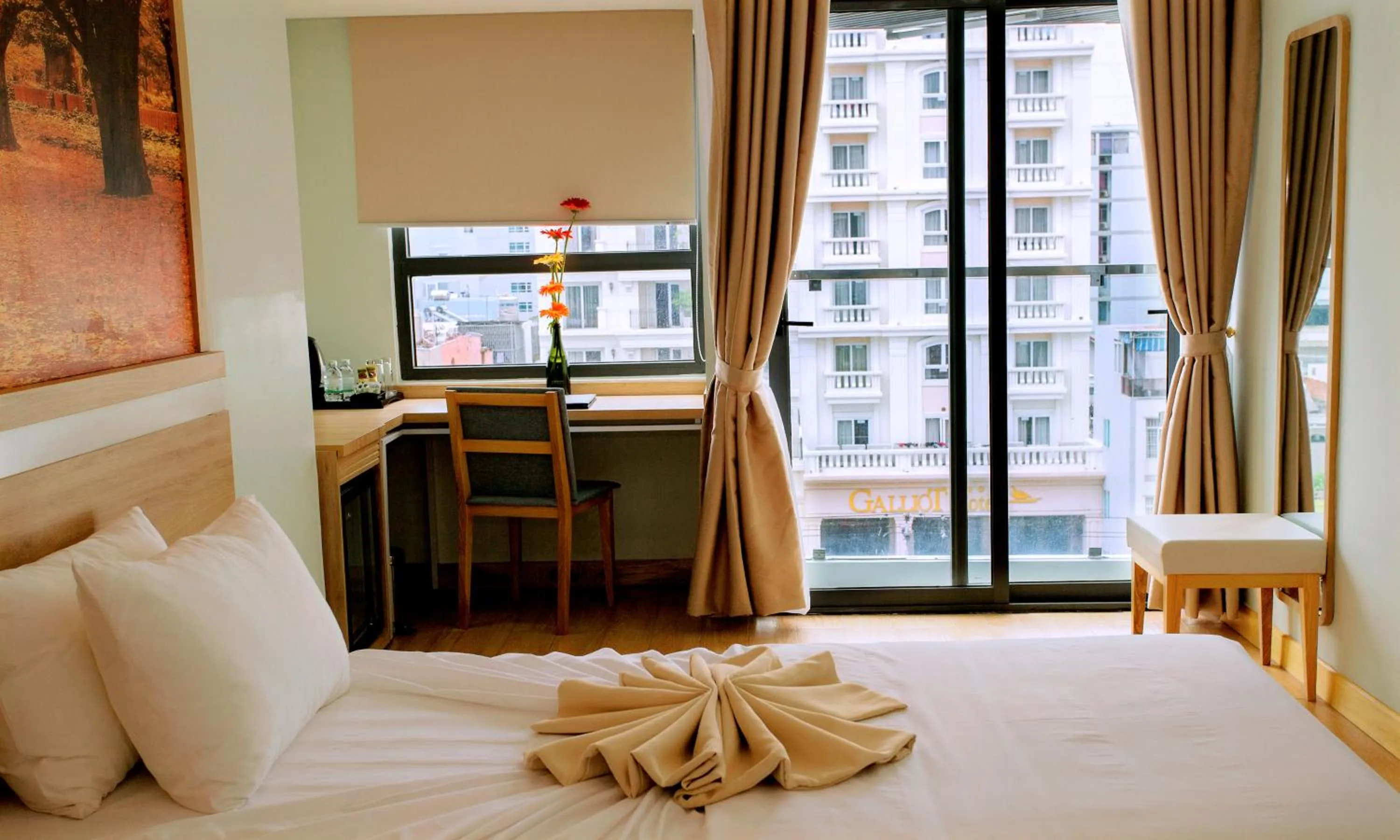 Bed in Royal HPM Hotel