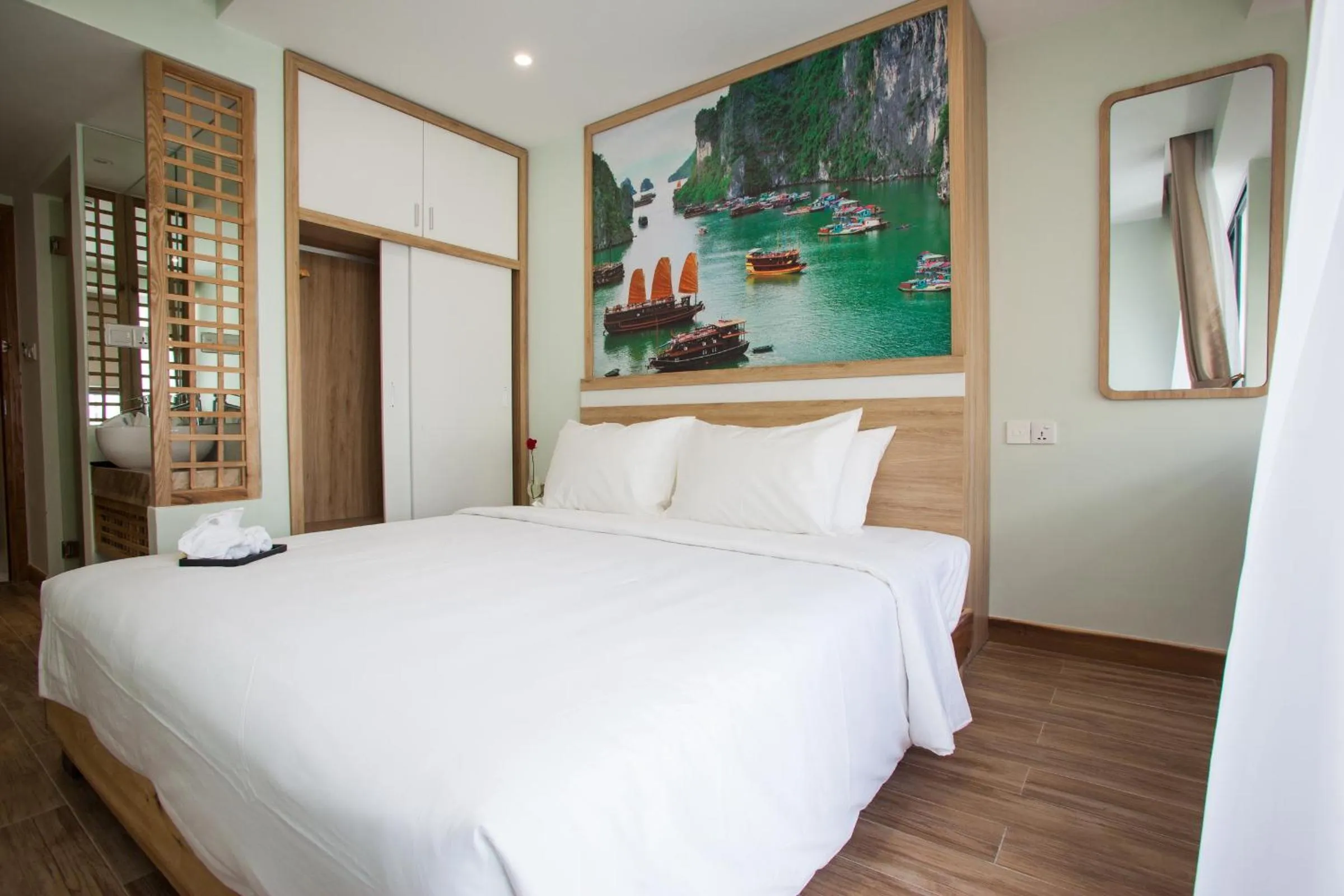 Bed in Royal HPM Hotel