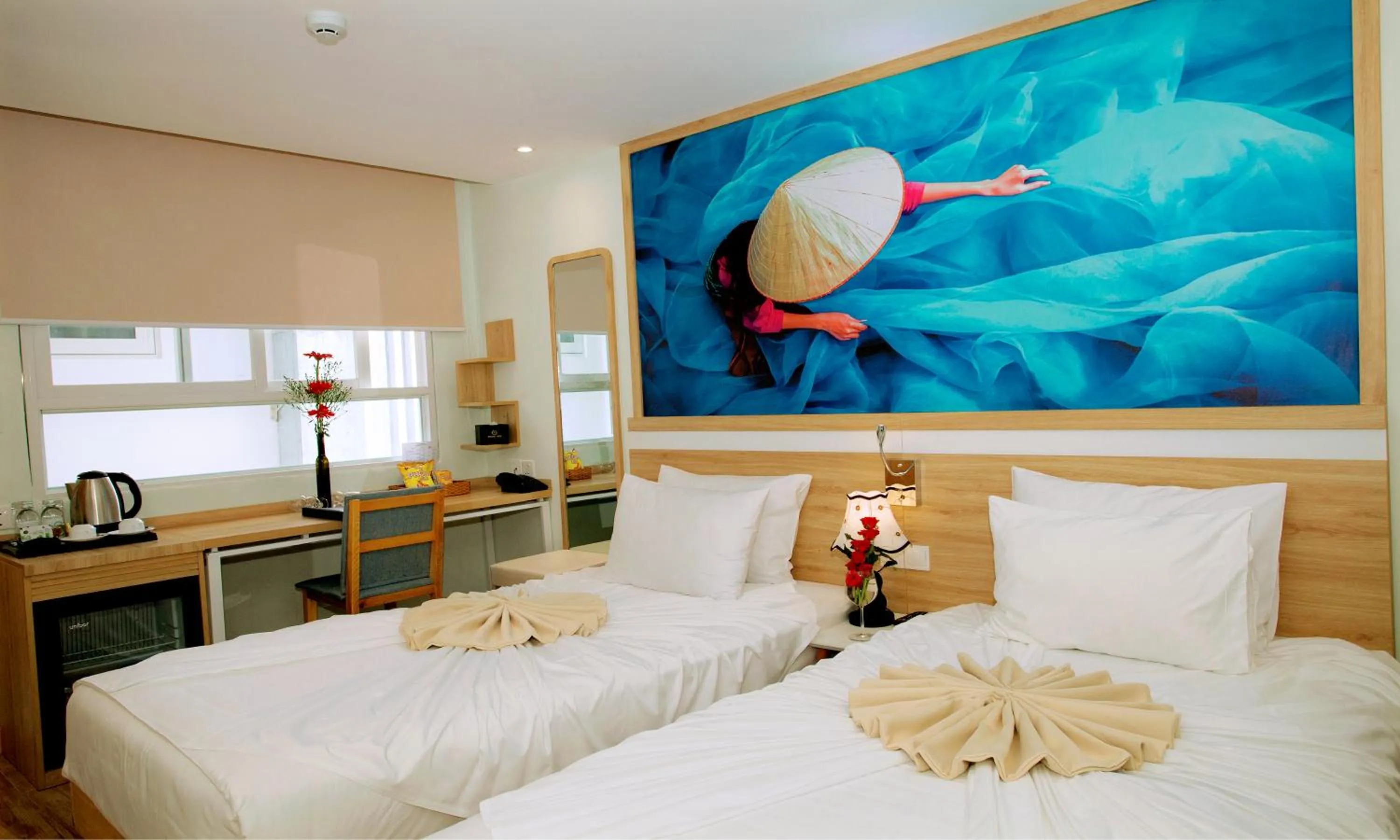 Bed in Royal HPM Hotel