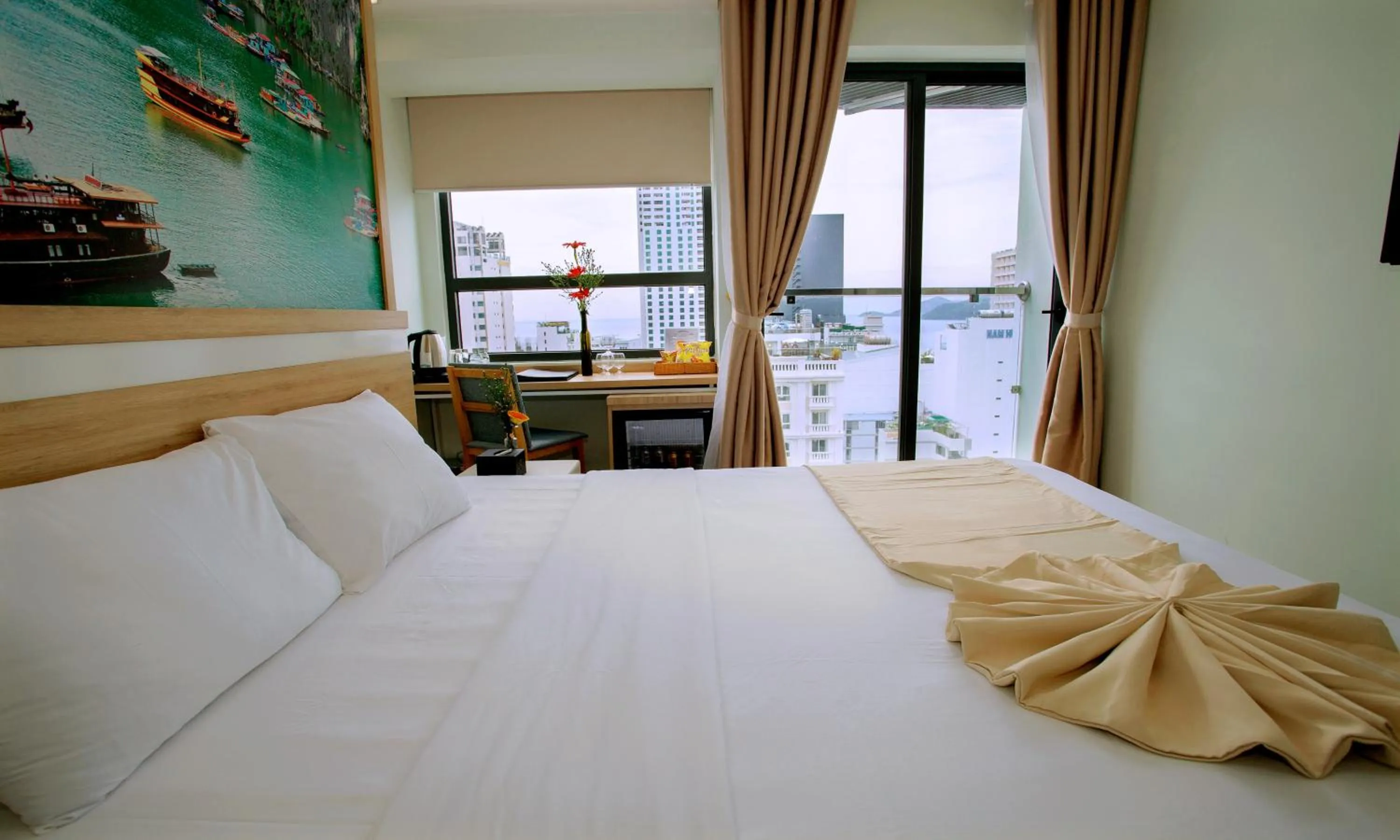 Bed in Royal HPM Hotel