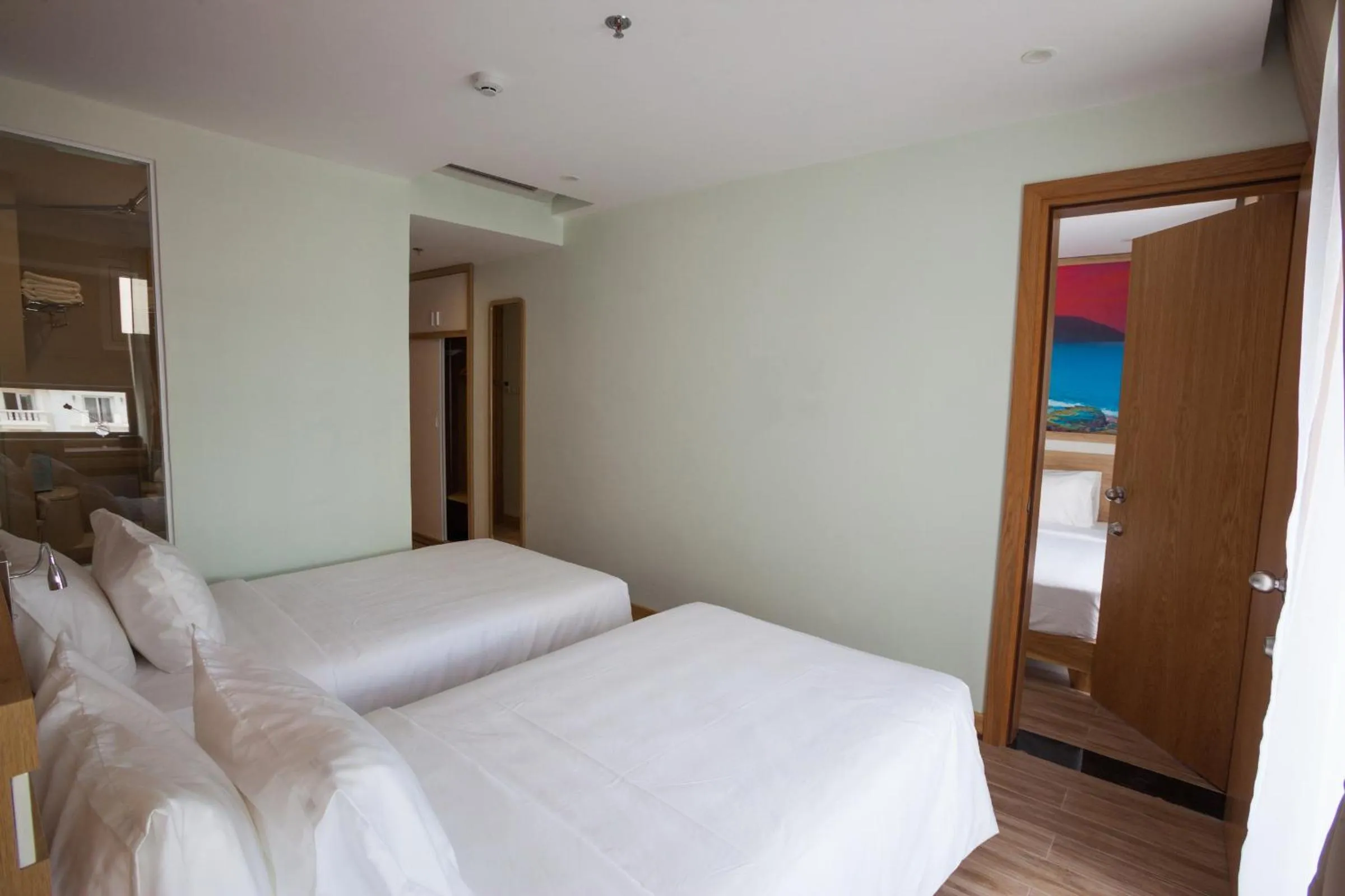 Bed in Royal HPM Hotel