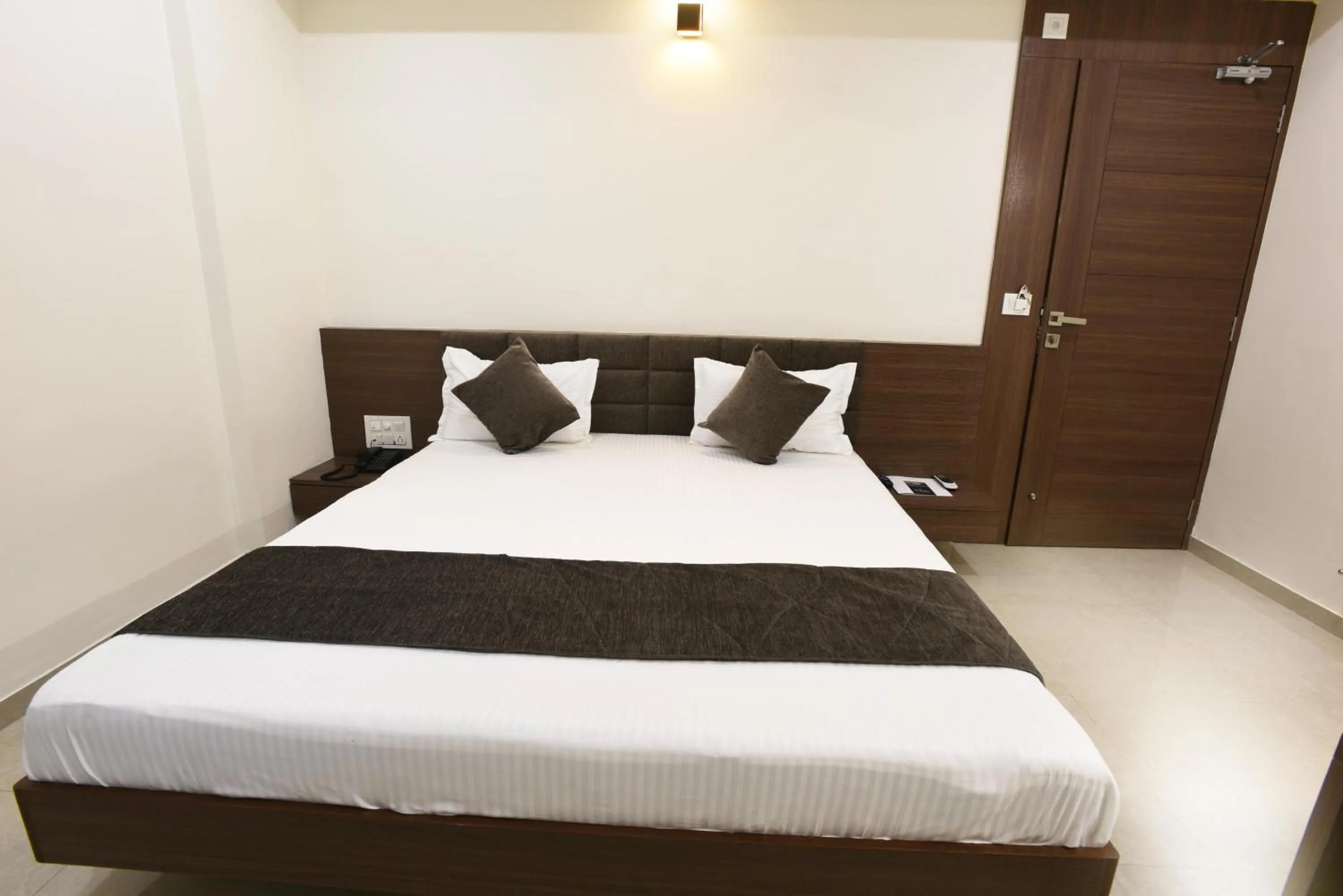 Bed in Hotel Luxura, Ahmedabad
