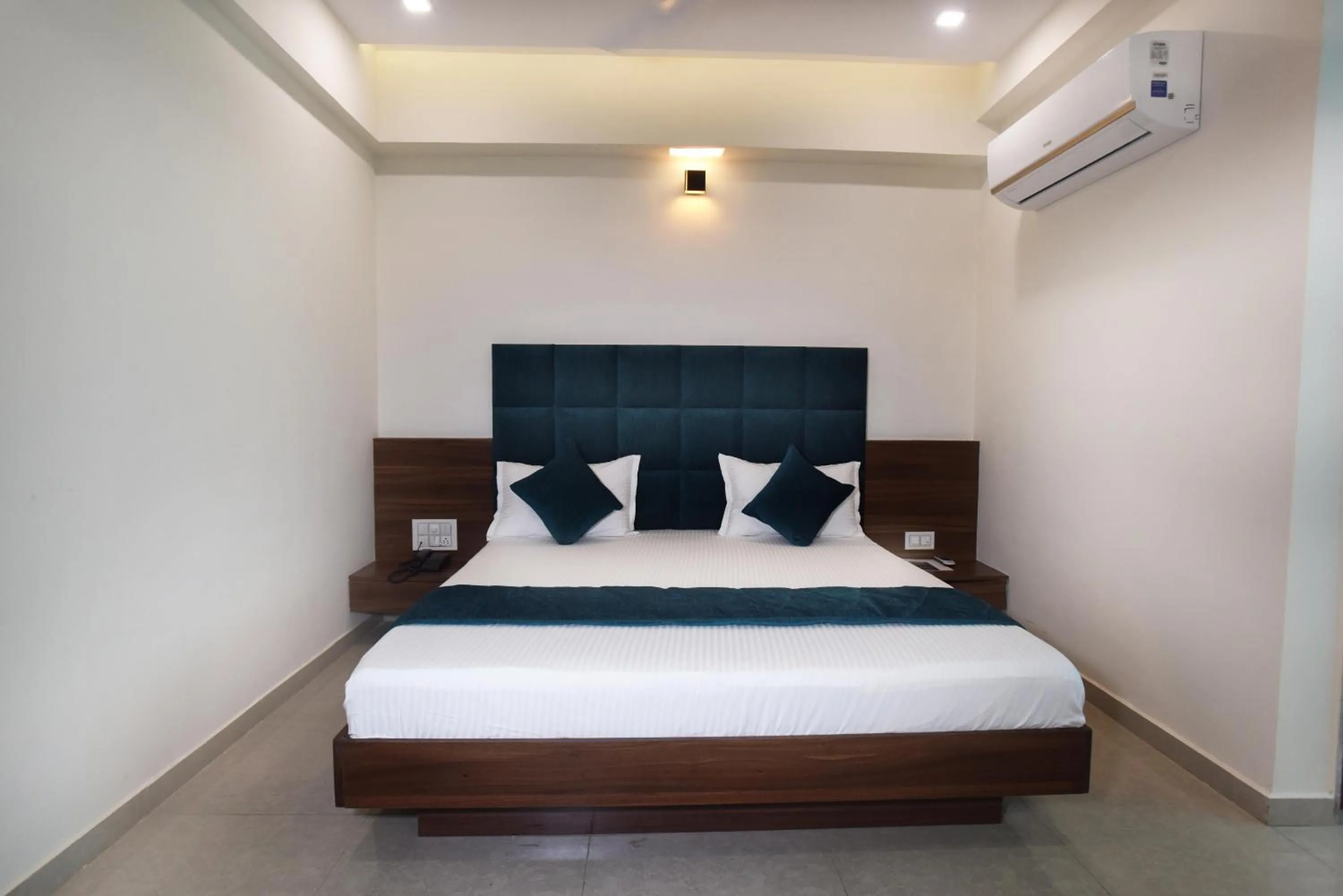 Bed in Hotel Luxura, Ahmedabad
