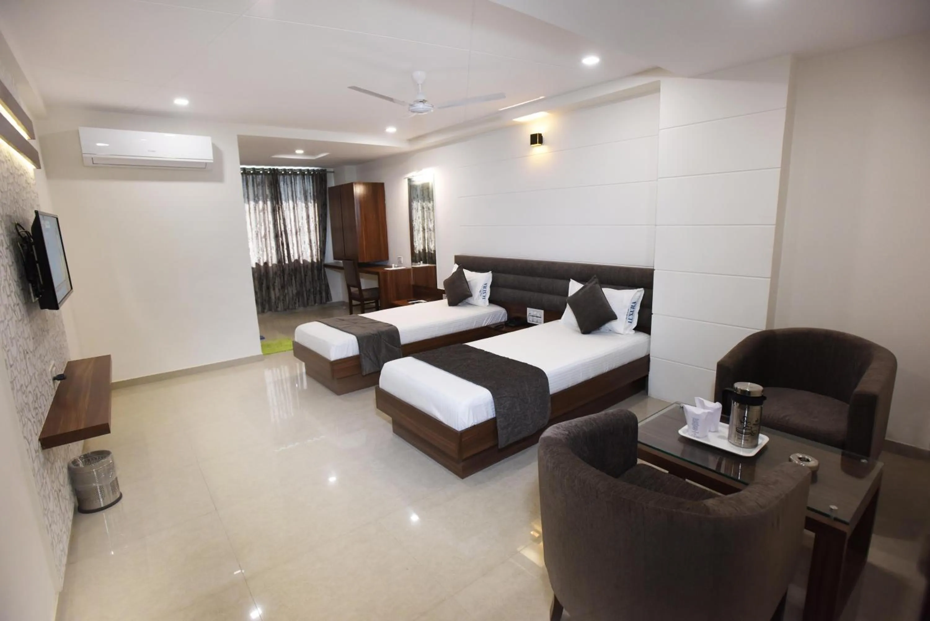 Bed in Hotel Luxura, Ahmedabad