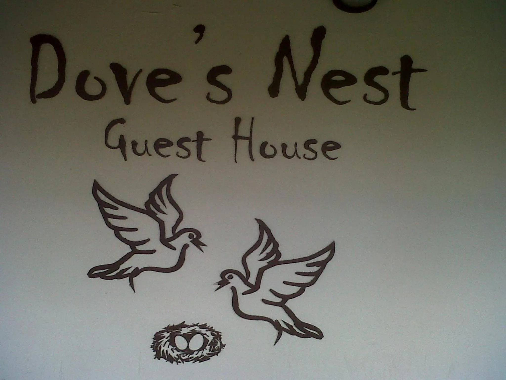 Property logo or sign in Dove's Nest Guest House