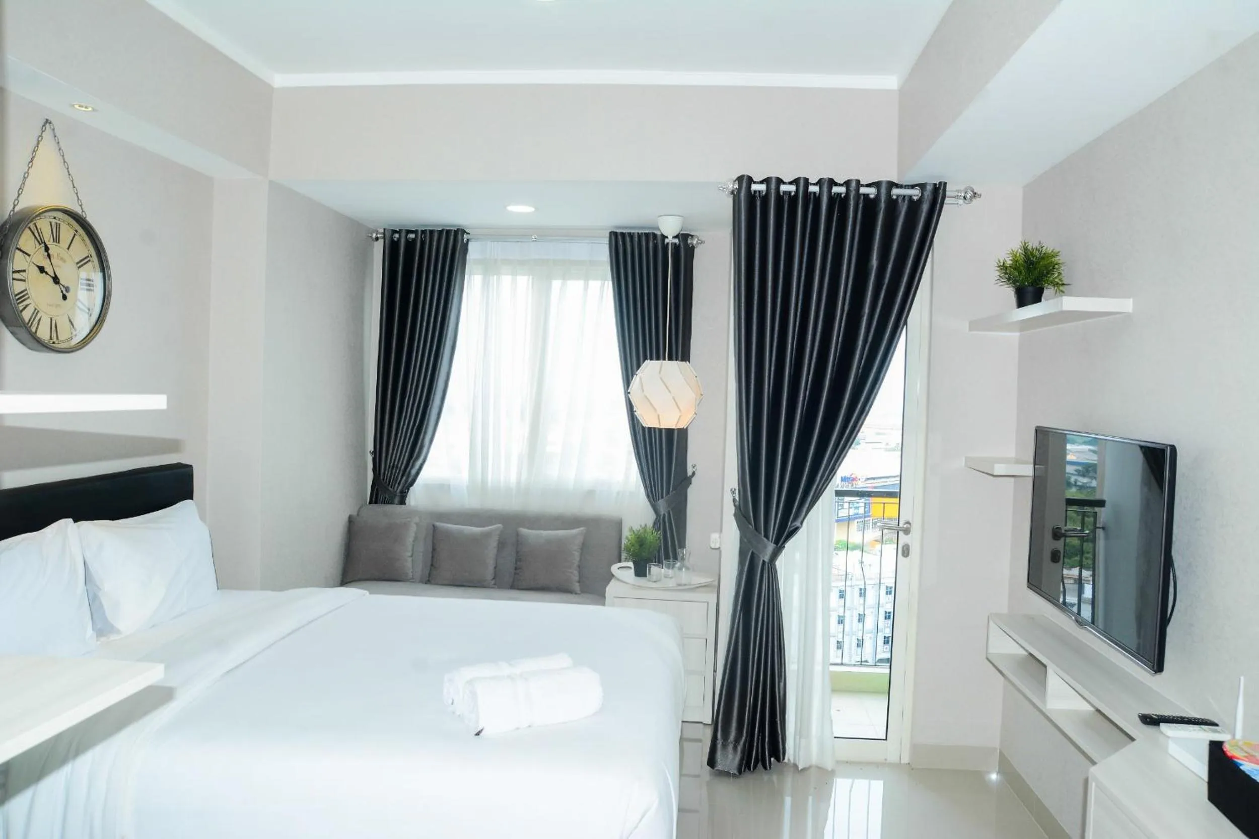 Bedroom, Bed in Sophisticated Studio at The Oasis Apartment By Travelio