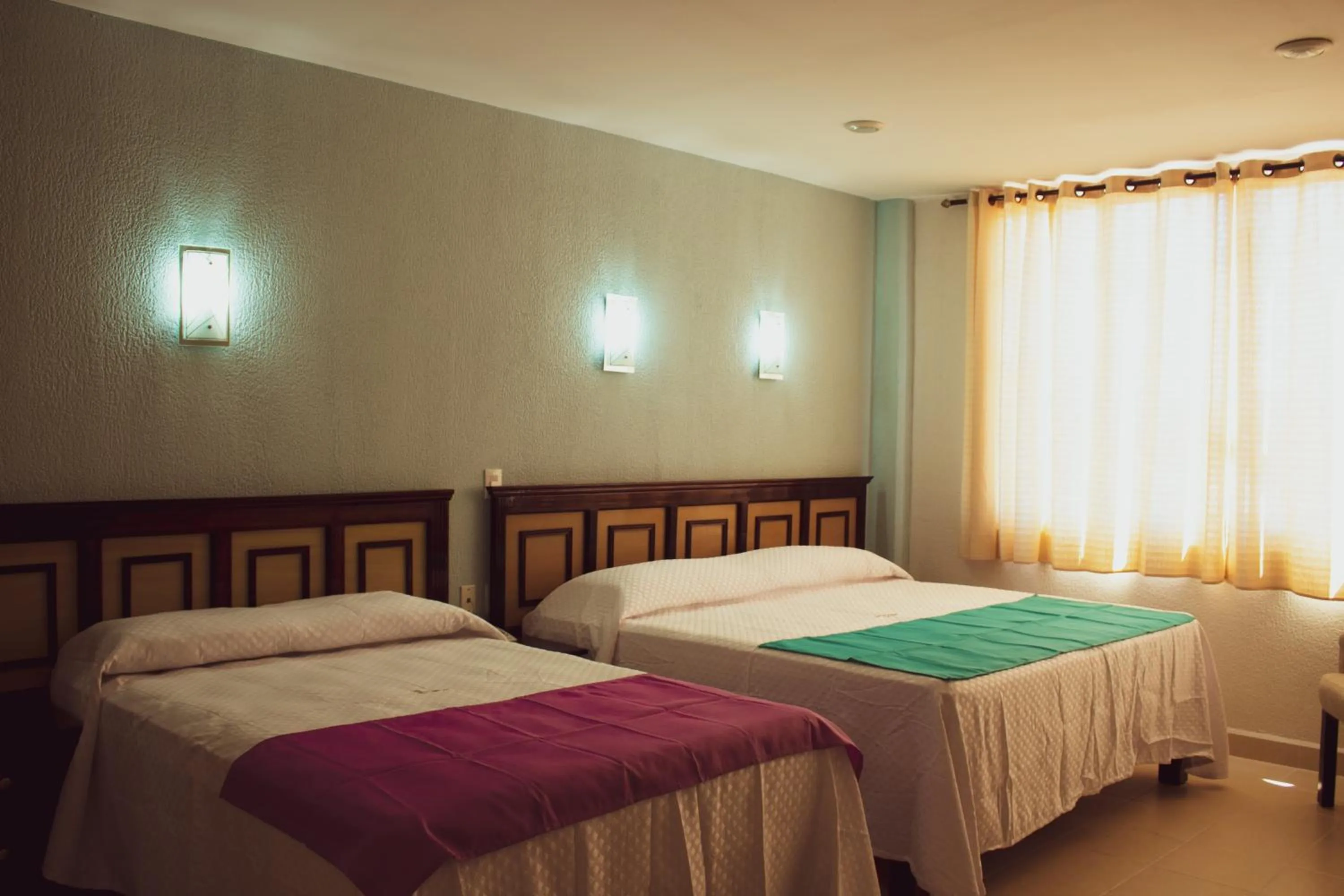 Bed in HOTEL DE LA PEÑA INN