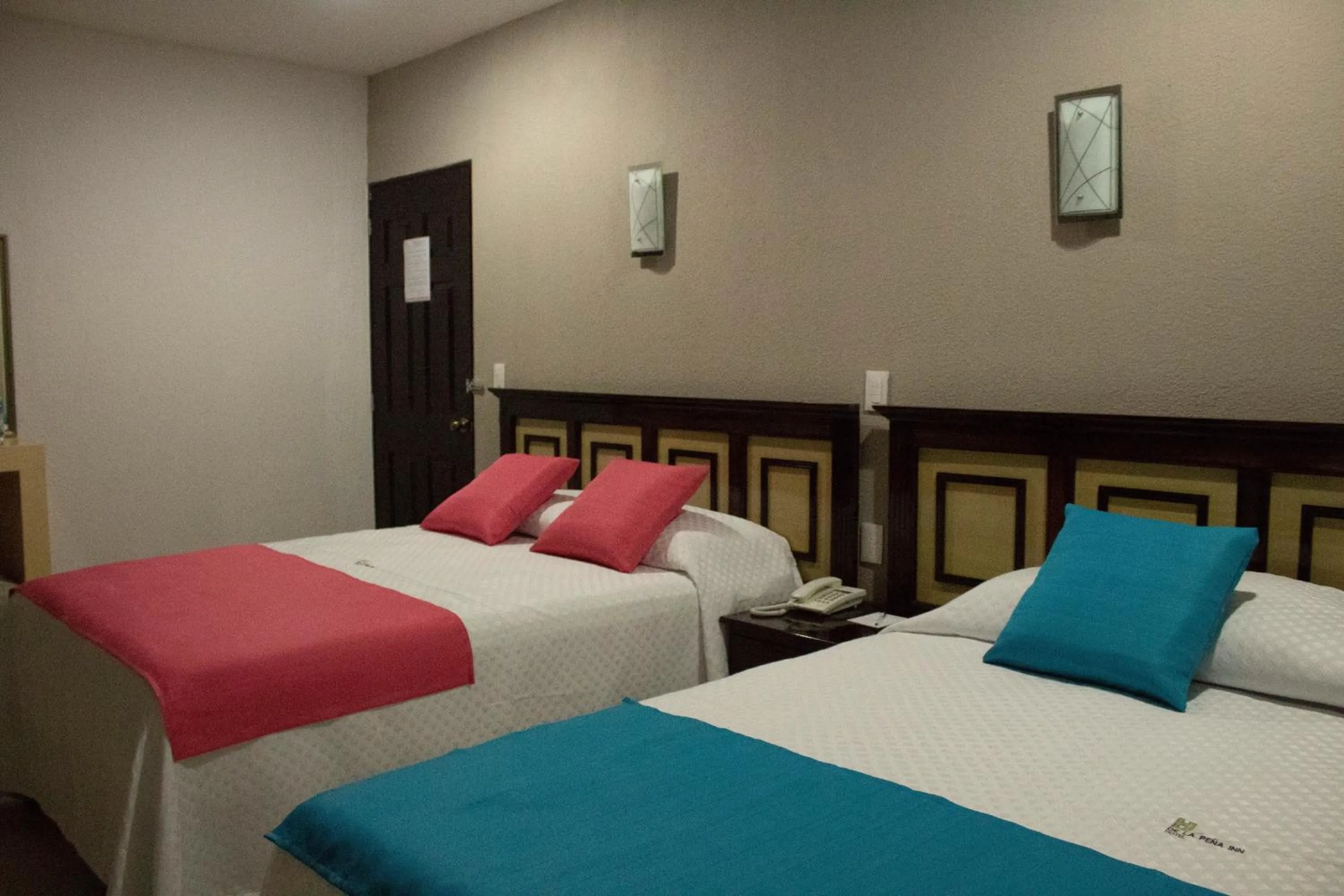 Bed in HOTEL DE LA PEÑA INN