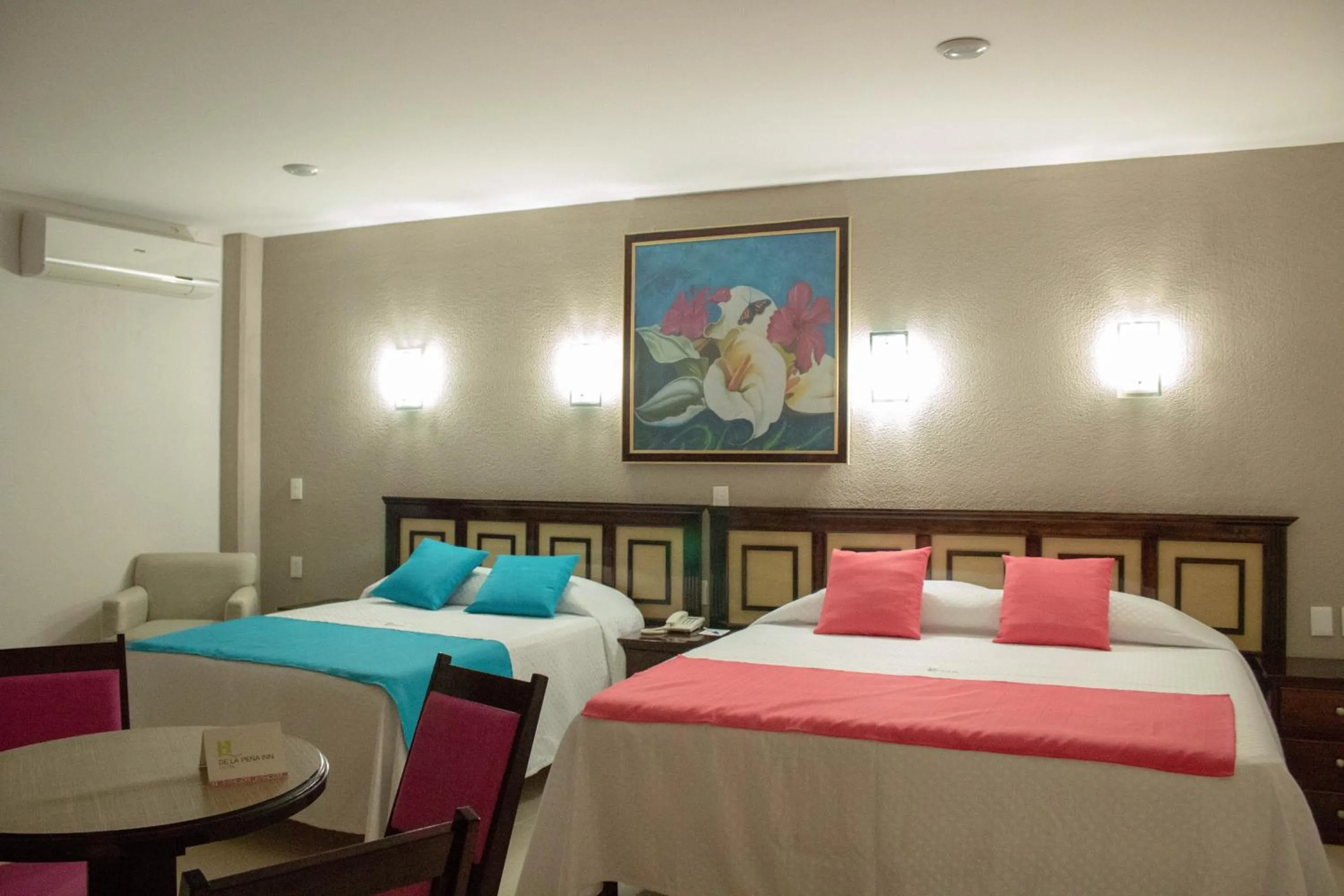 Bed in HOTEL DE LA PEÑA INN