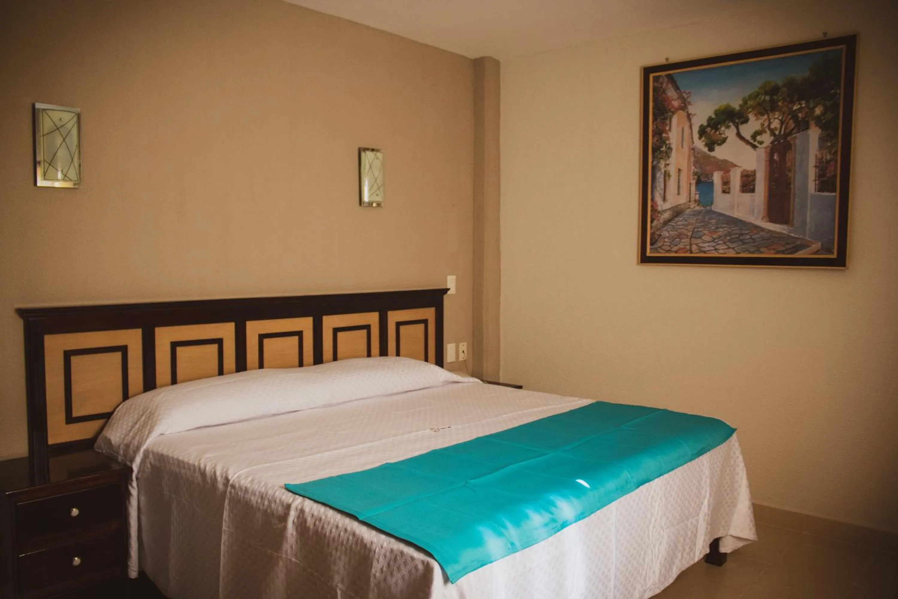 Bed in HOTEL DE LA PEÑA INN