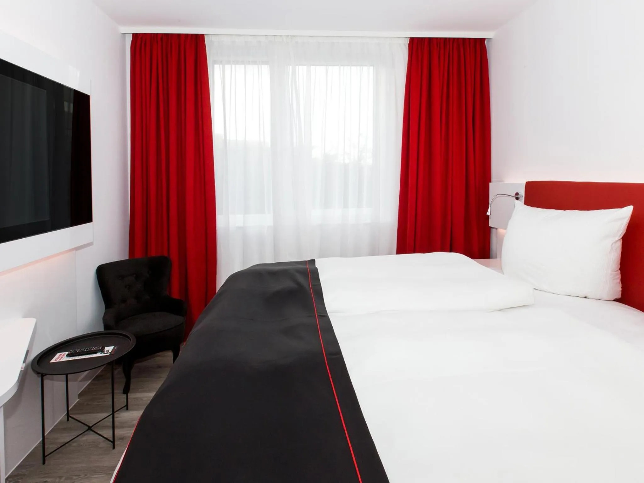 Photo of the whole room, Bed in DORMERO Hotel Salzgitter