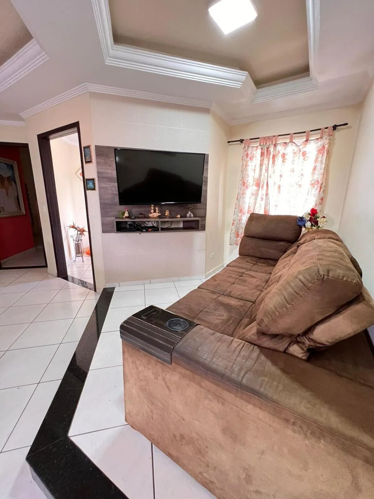 Communal lounge/ TV room in Casa Aconchegante no Centro de Foz do Iguaçu