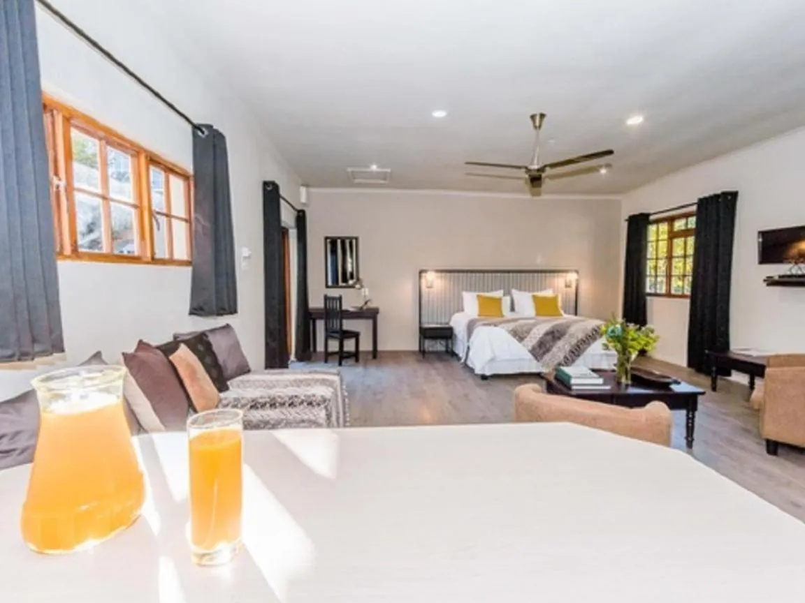 Bed in Le Petit Chateau Guest House