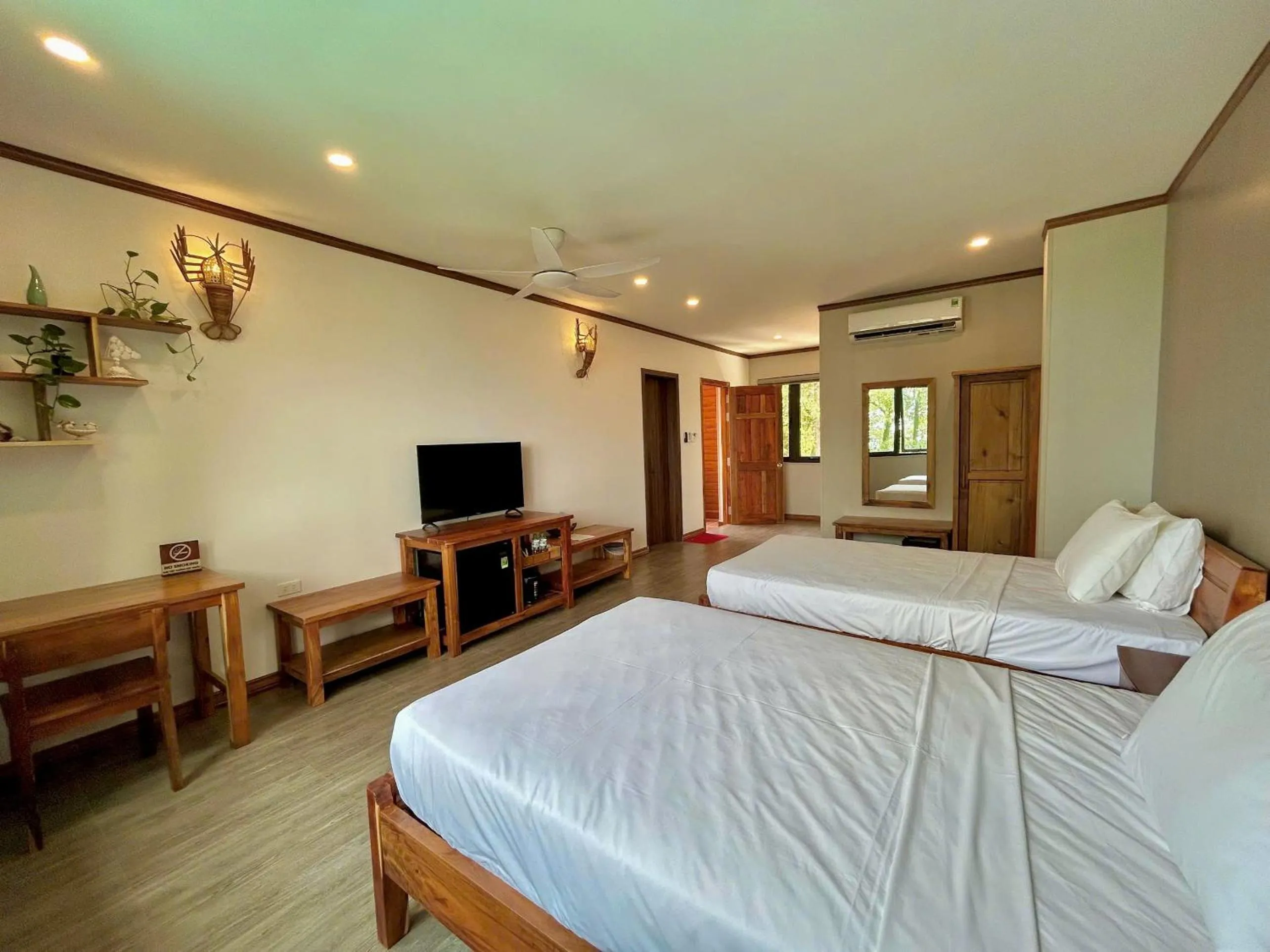 Bed in Ancarine Beach Resort