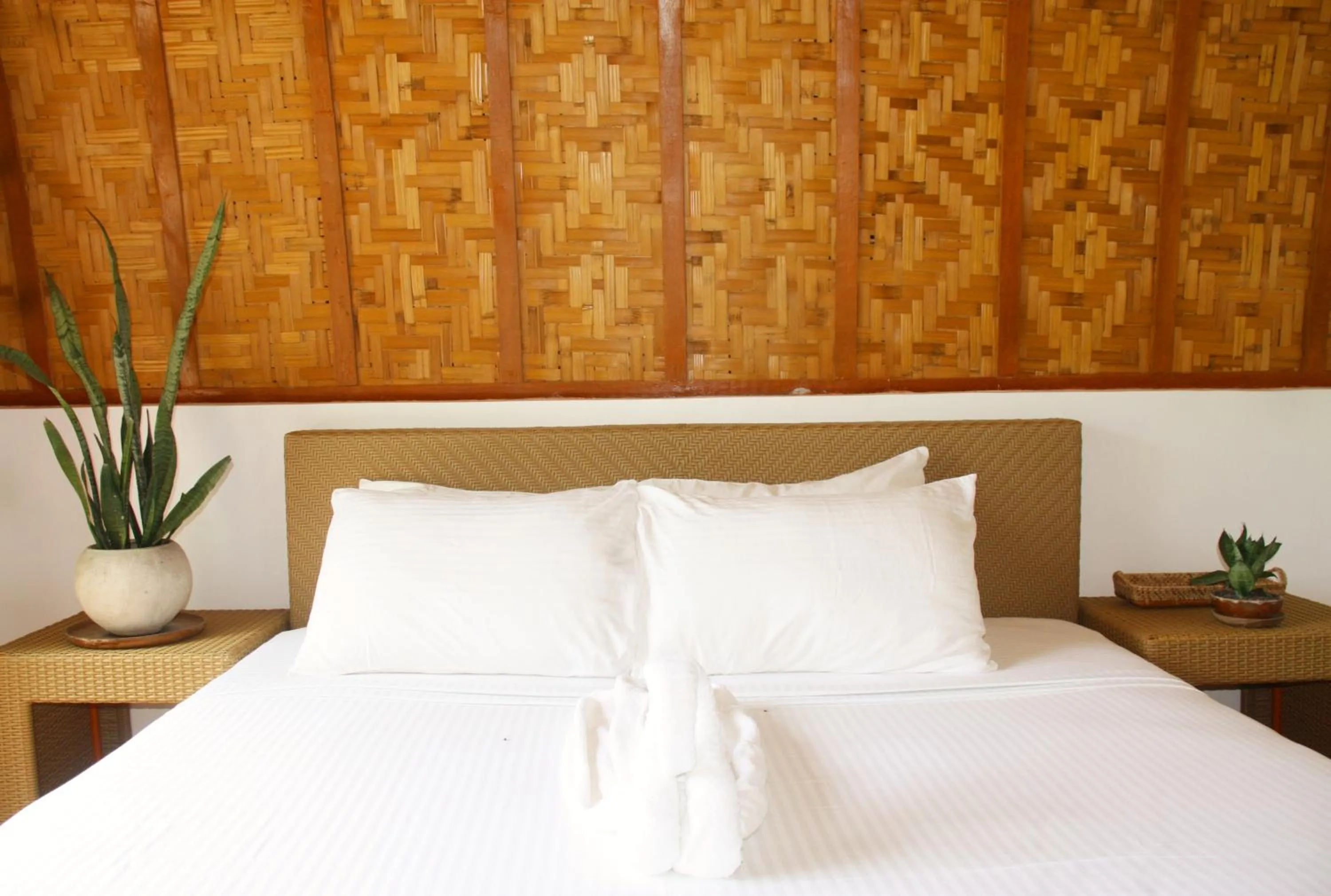 Bed in Tropical Temple Siargao Resort