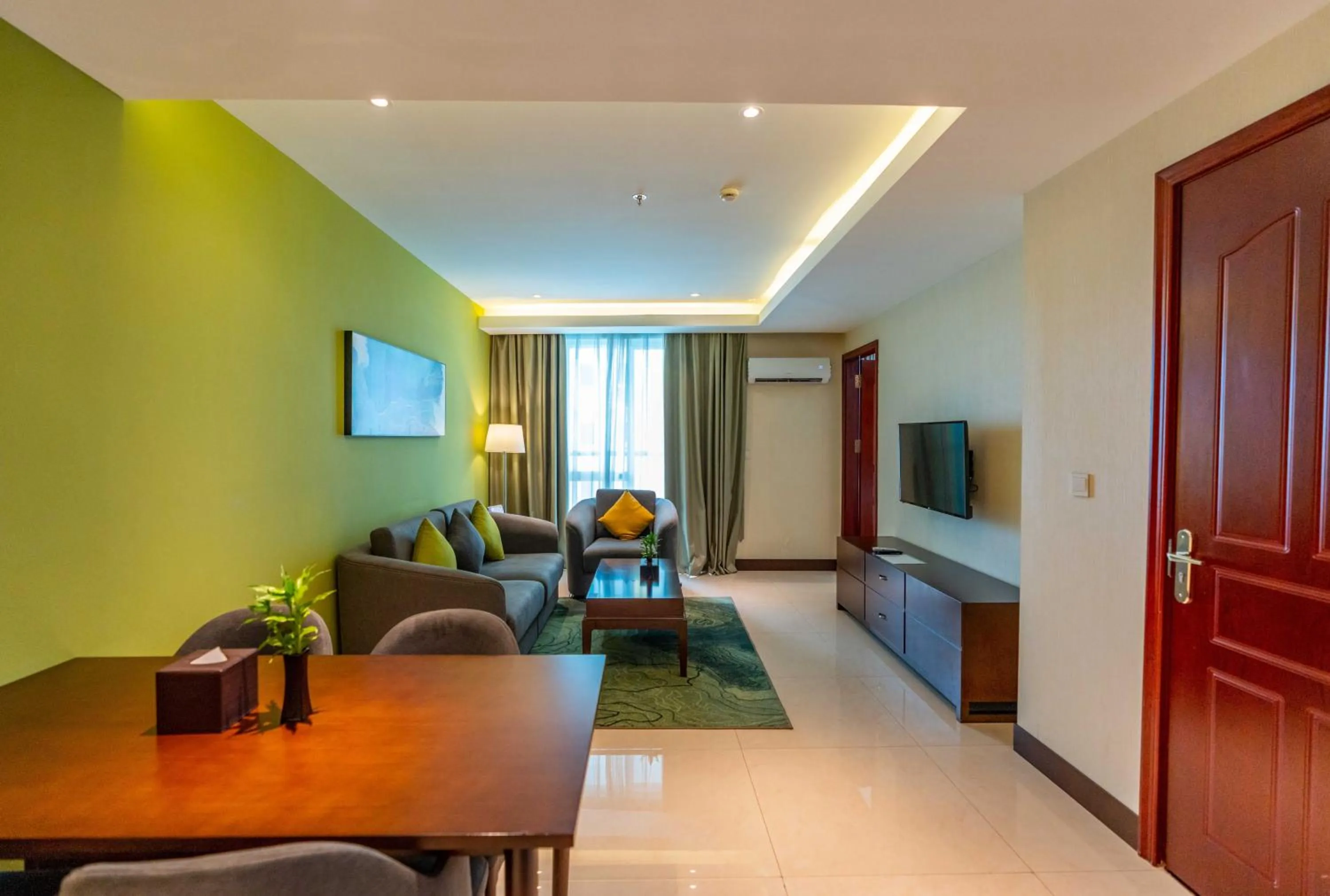 Living room in Olympia City Hotel by Dara