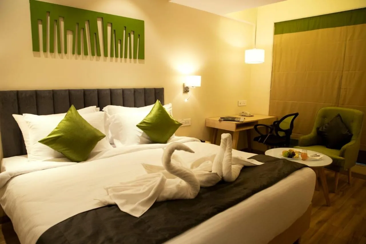 Photo of the whole room, Bed in Regenta Central Harsha Vapi