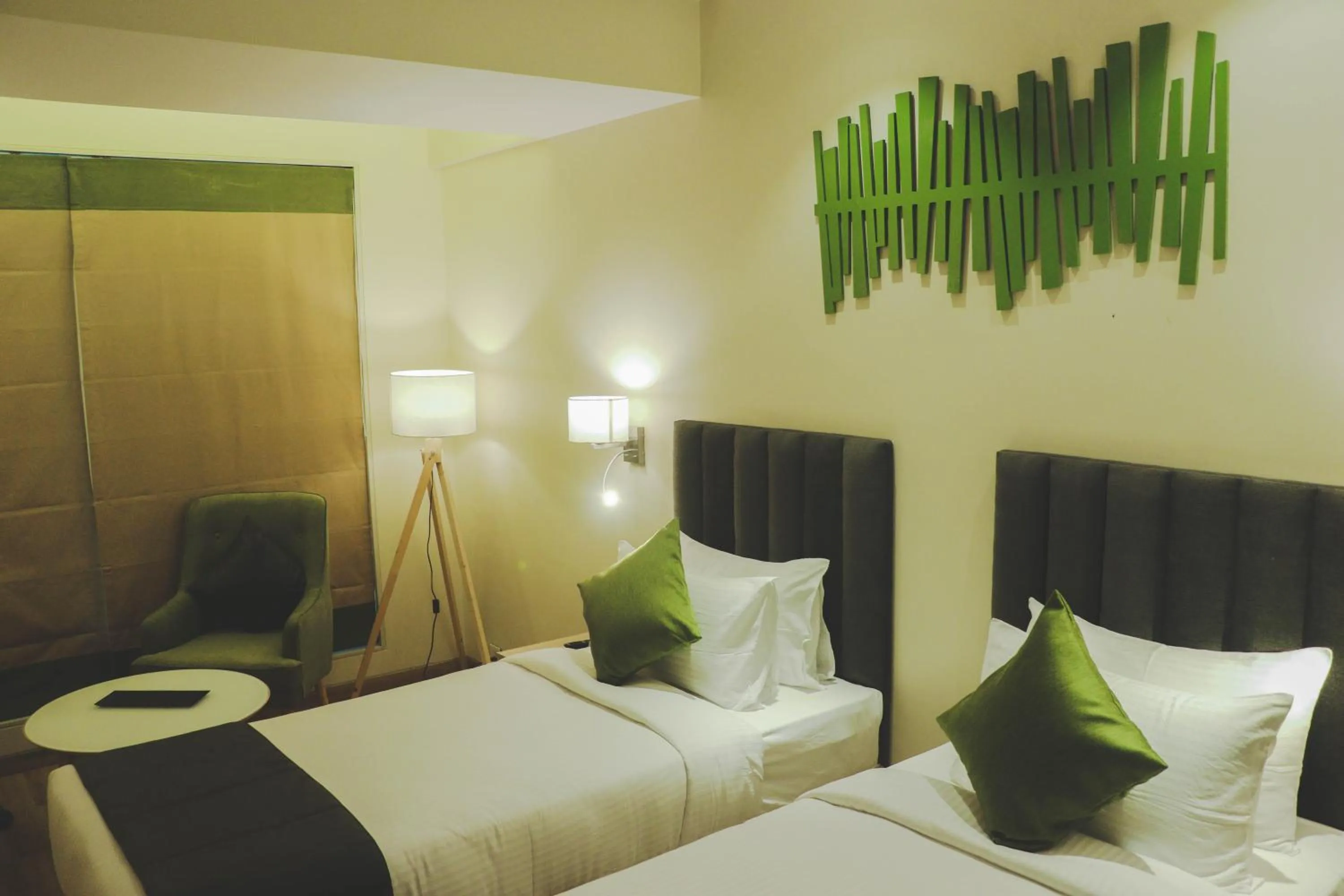 Photo of the whole room, Bed in Regenta Central Harsha Vapi