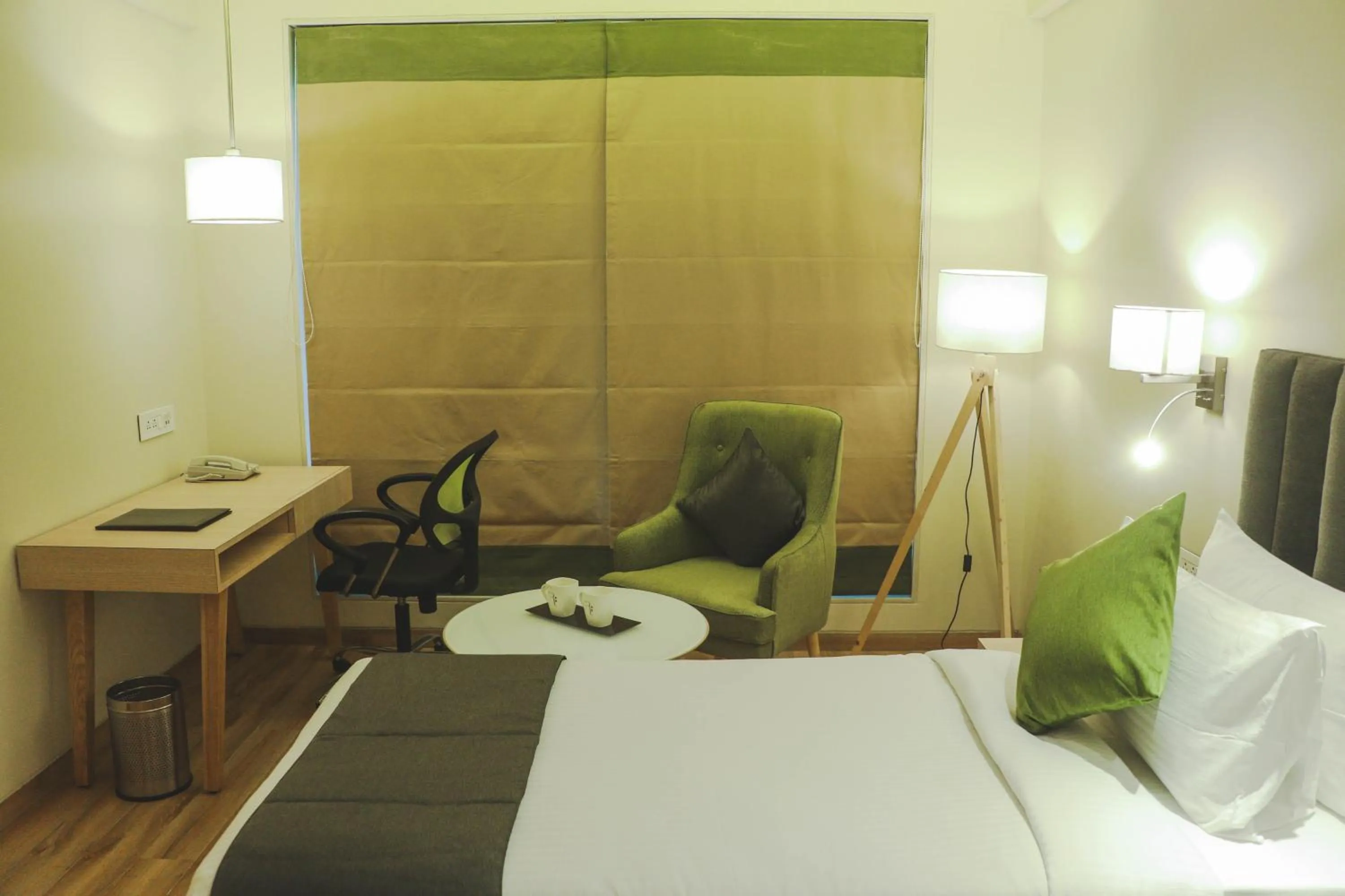 Photo of the whole room, Bed in Regenta Central Harsha Vapi