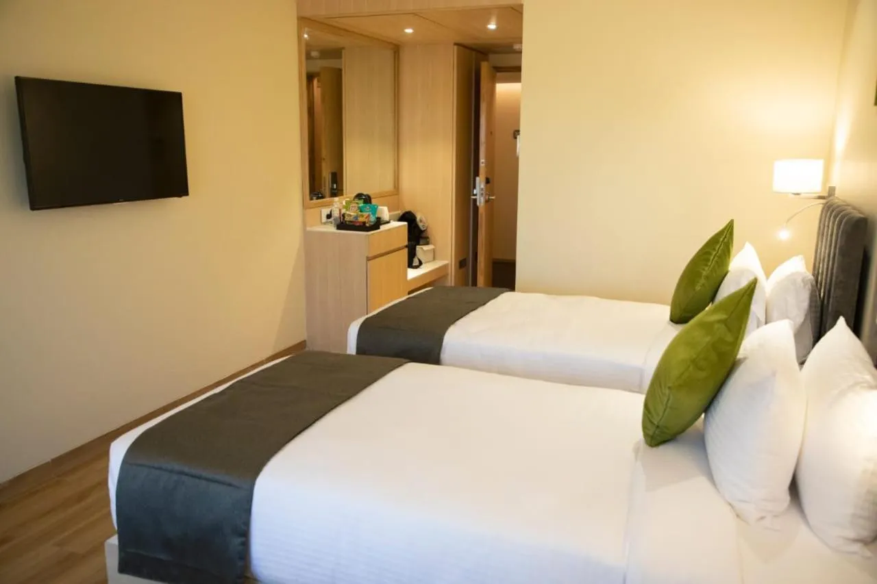 Photo of the whole room, Bed in Regenta Central Harsha Vapi