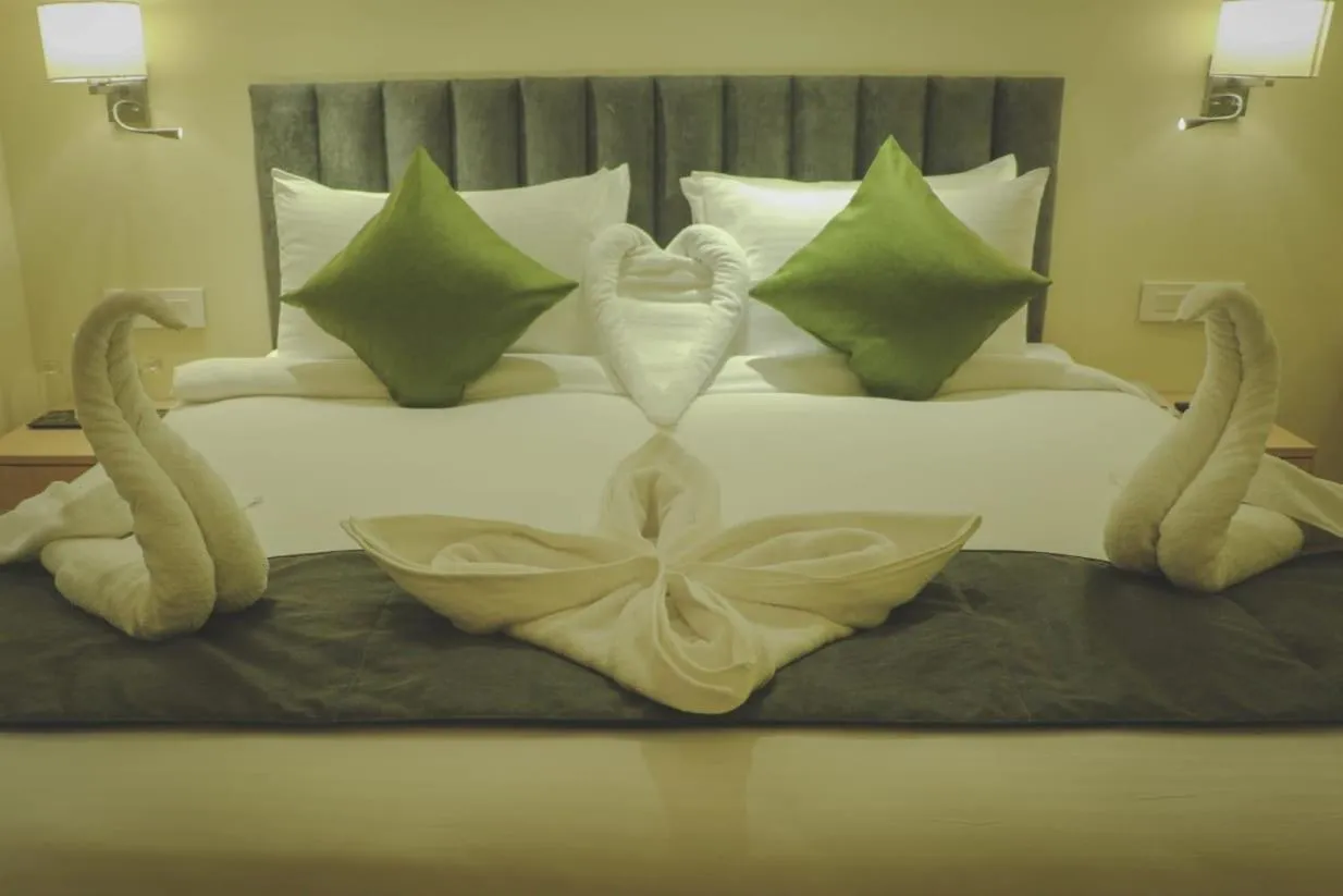 Photo of the whole room, Bed in Regenta Central Harsha Vapi