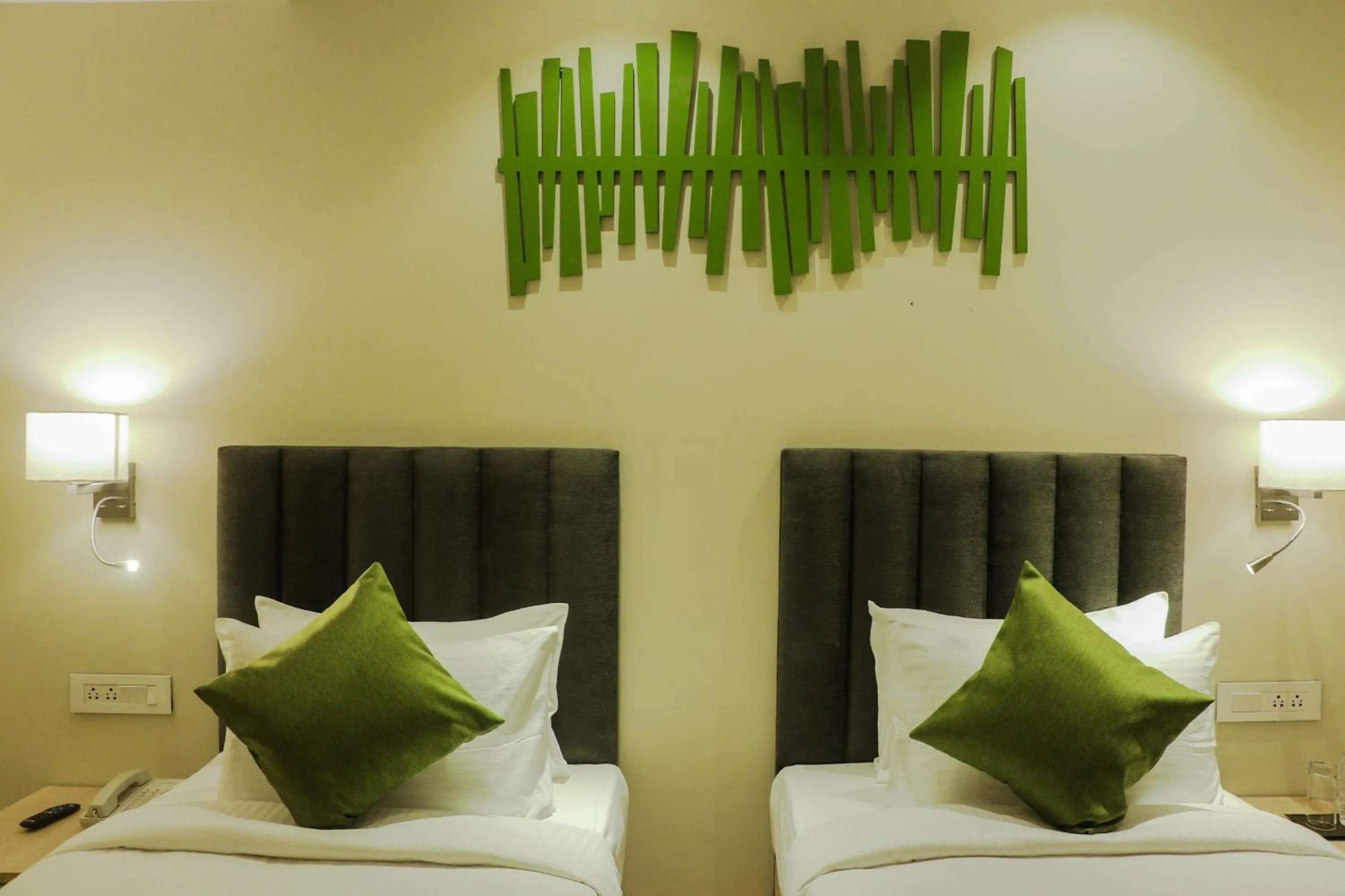 Photo of the whole room, Bed in Regenta Central Harsha Vapi