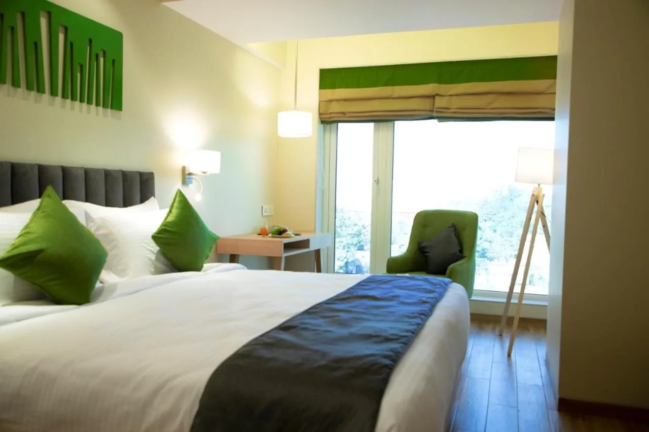 Photo of the whole room, Bed in Regenta Central Harsha Vapi