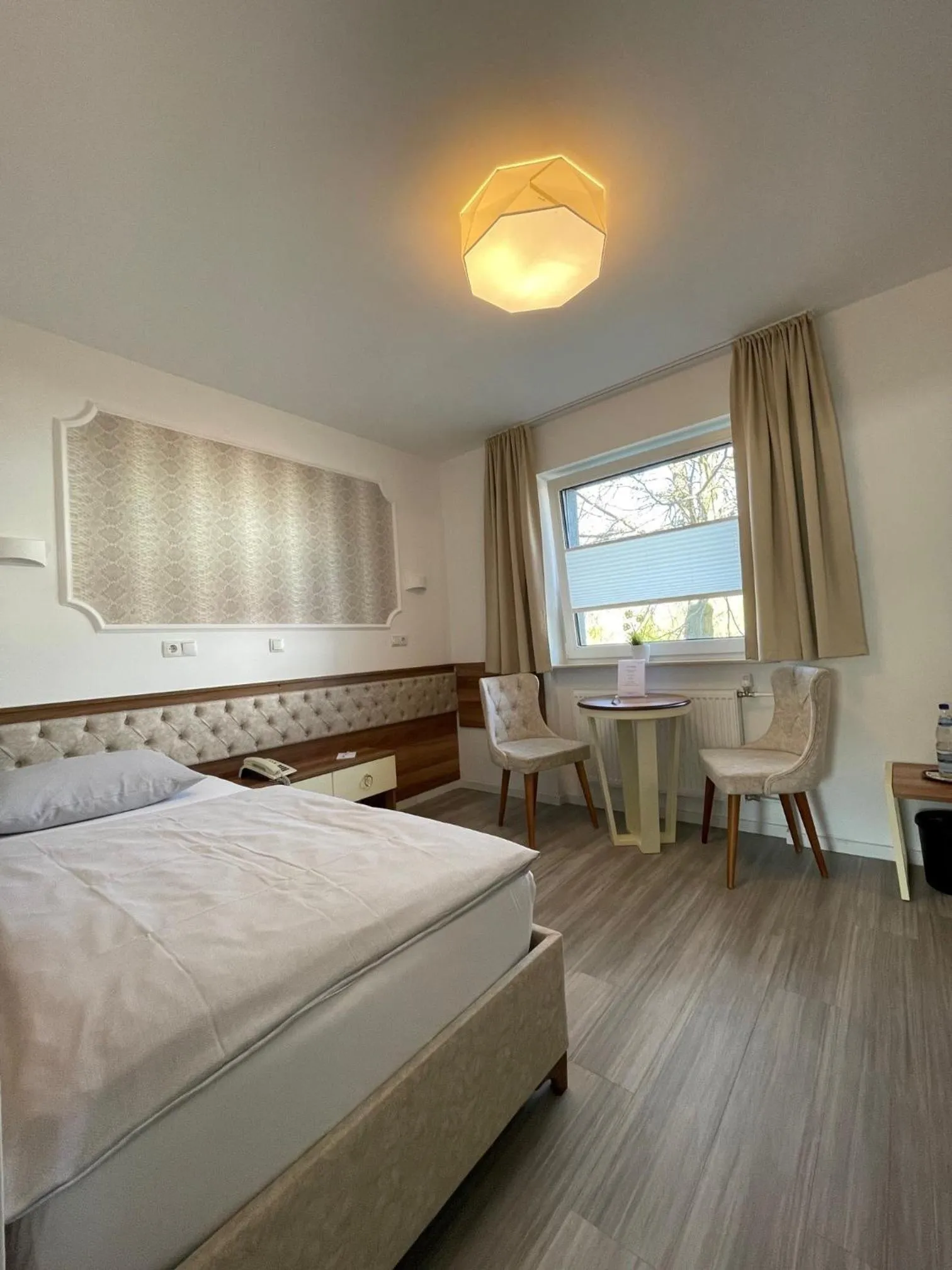 Bed in Hotel Rosenheim