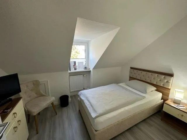 Bed in Hotel Rosenheim