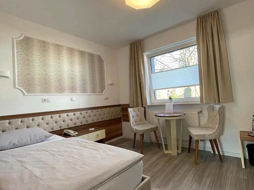 Bed in Hotel Rosenheim