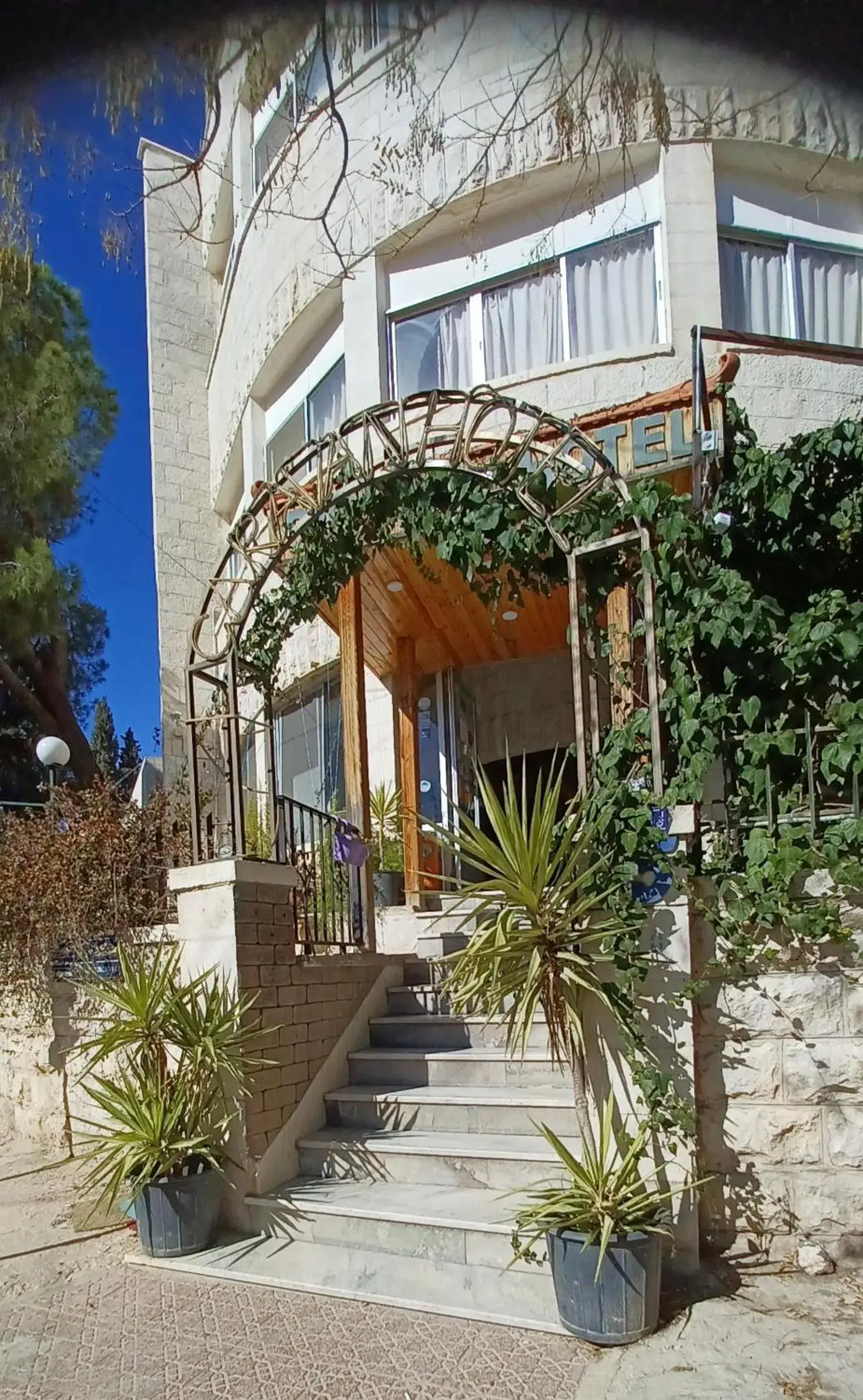 Facade/entrance, Property Building in Caravan Hotel