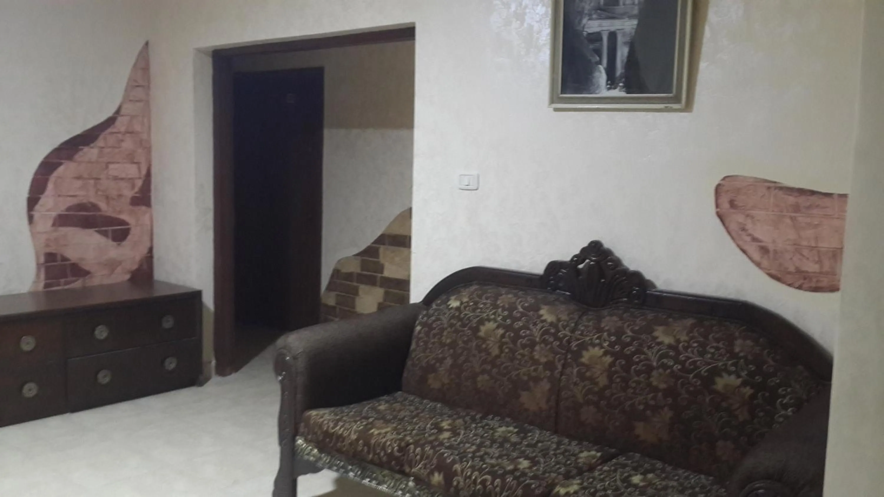 Communal lounge/ TV room, Seating Area in Caravan Hotel