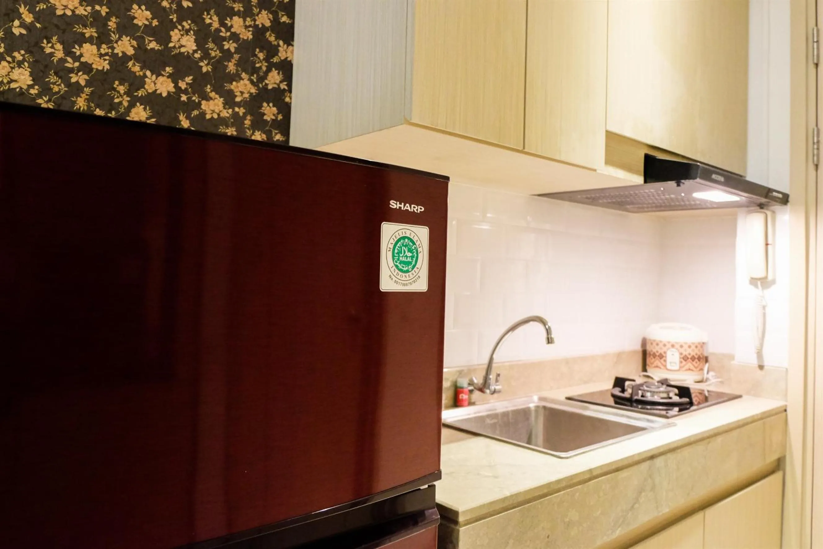 Kitchen or kitchenette in Prime Location Studio Apartment at Elpis Residence near Ancol By Travelio