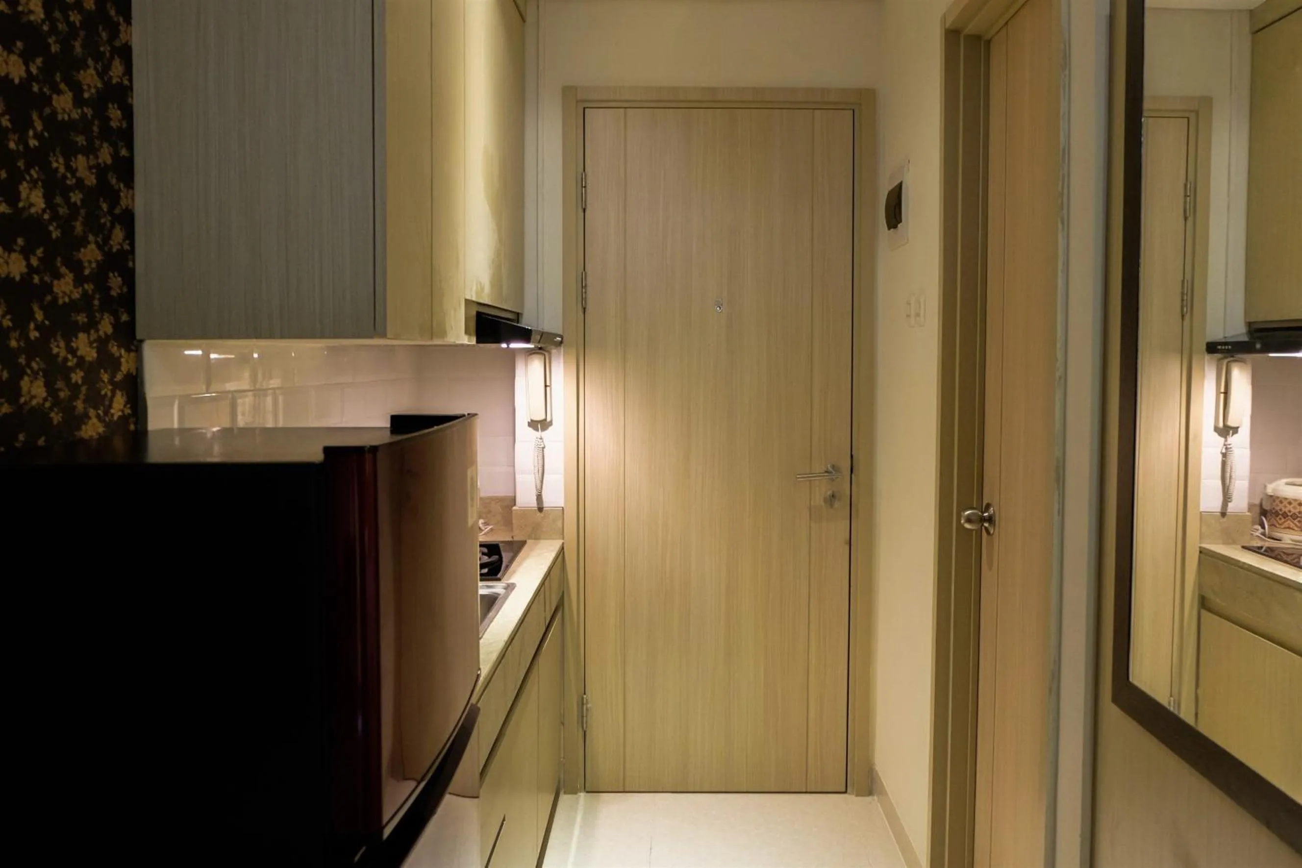 Kitchen or kitchenette in Prime Location Studio Apartment at Elpis Residence near Ancol By Travelio