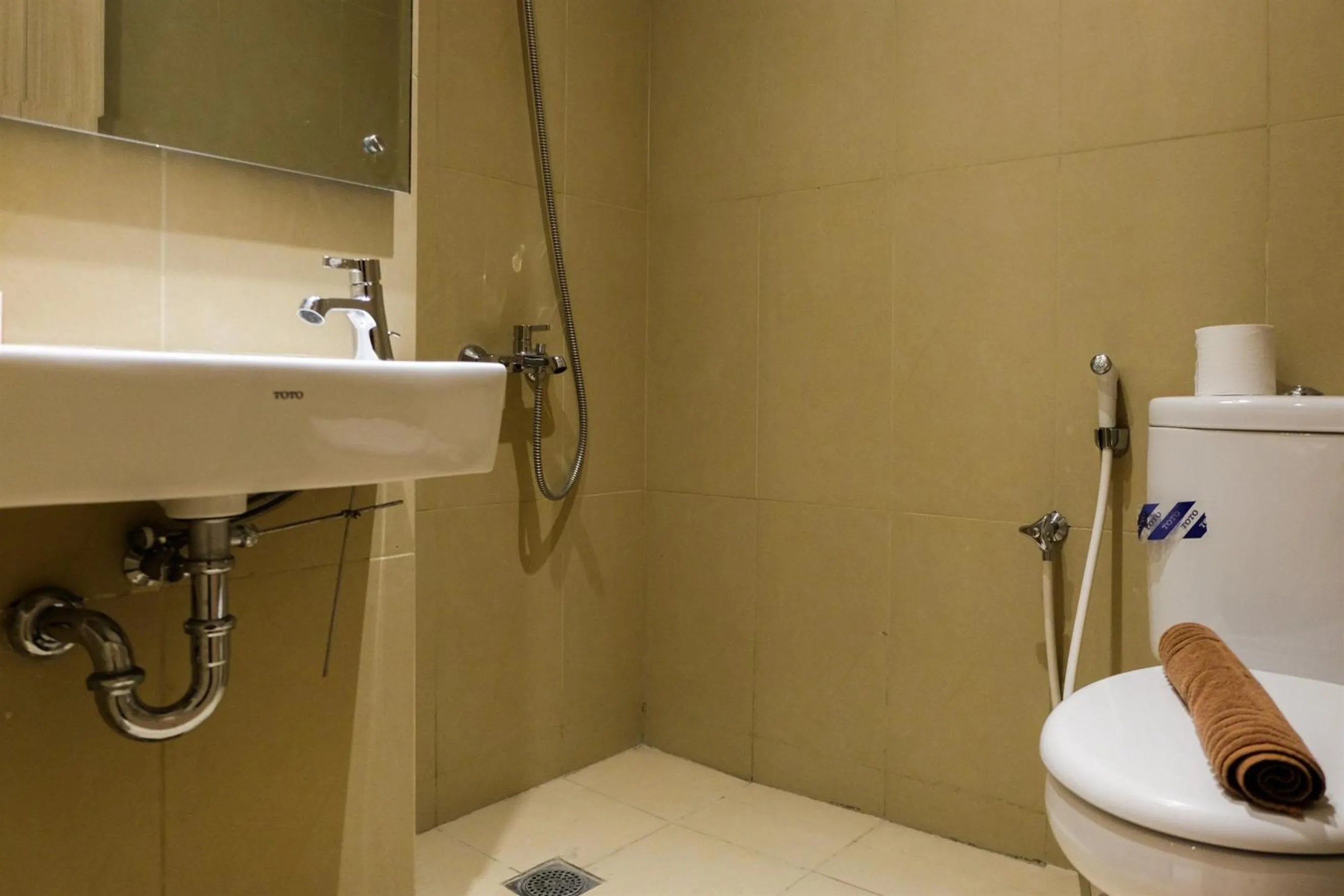 Bathroom in Prime Location Studio Apartment at Elpis Residence near Ancol By Travelio