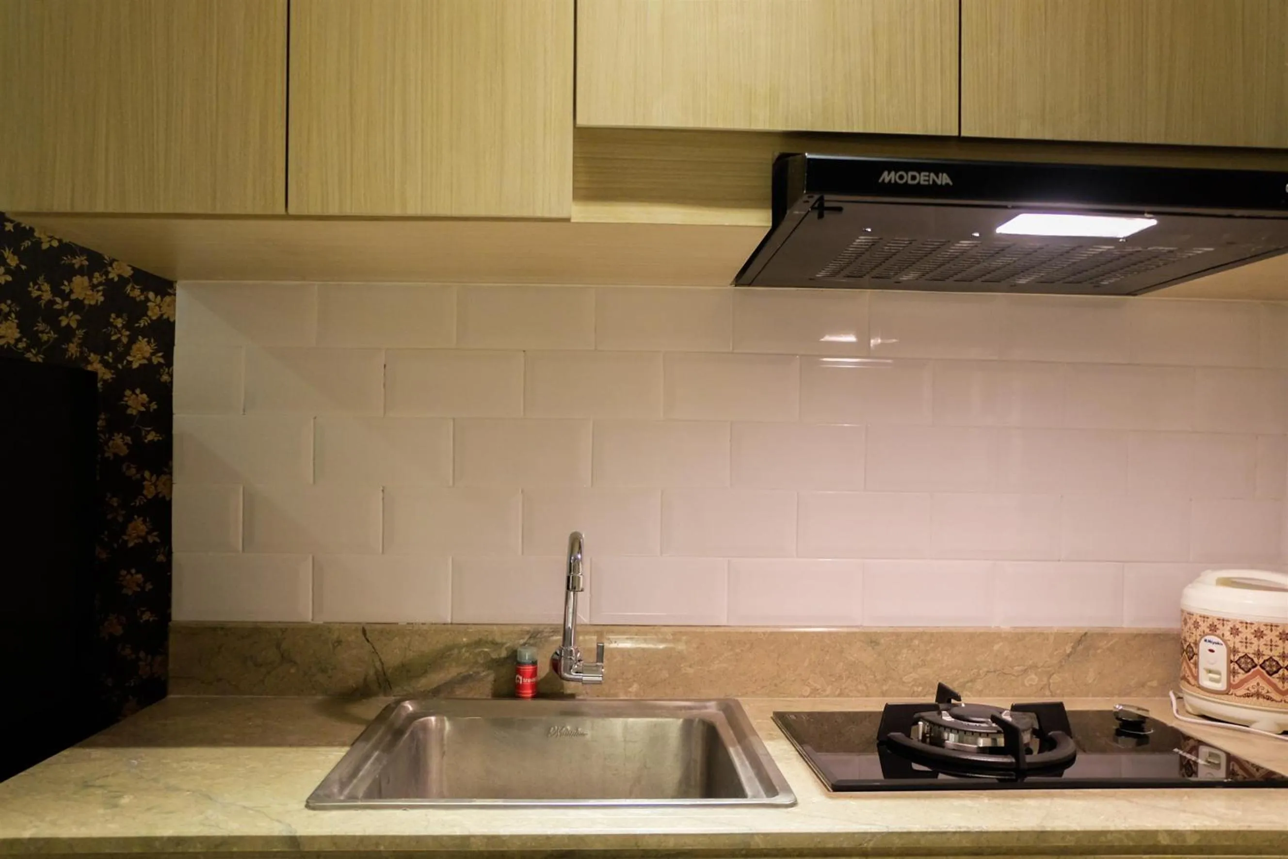 Kitchen or kitchenette in Prime Location Studio Apartment at Elpis Residence near Ancol By Travelio