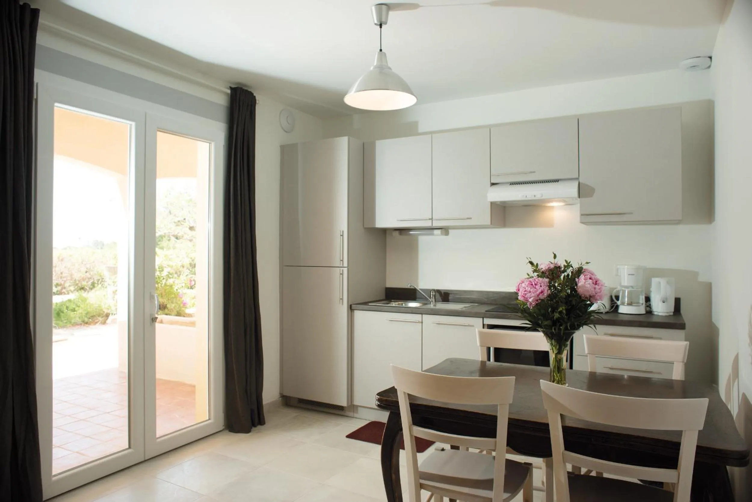 Kitchen or kitchenette in Appartements des Joncas